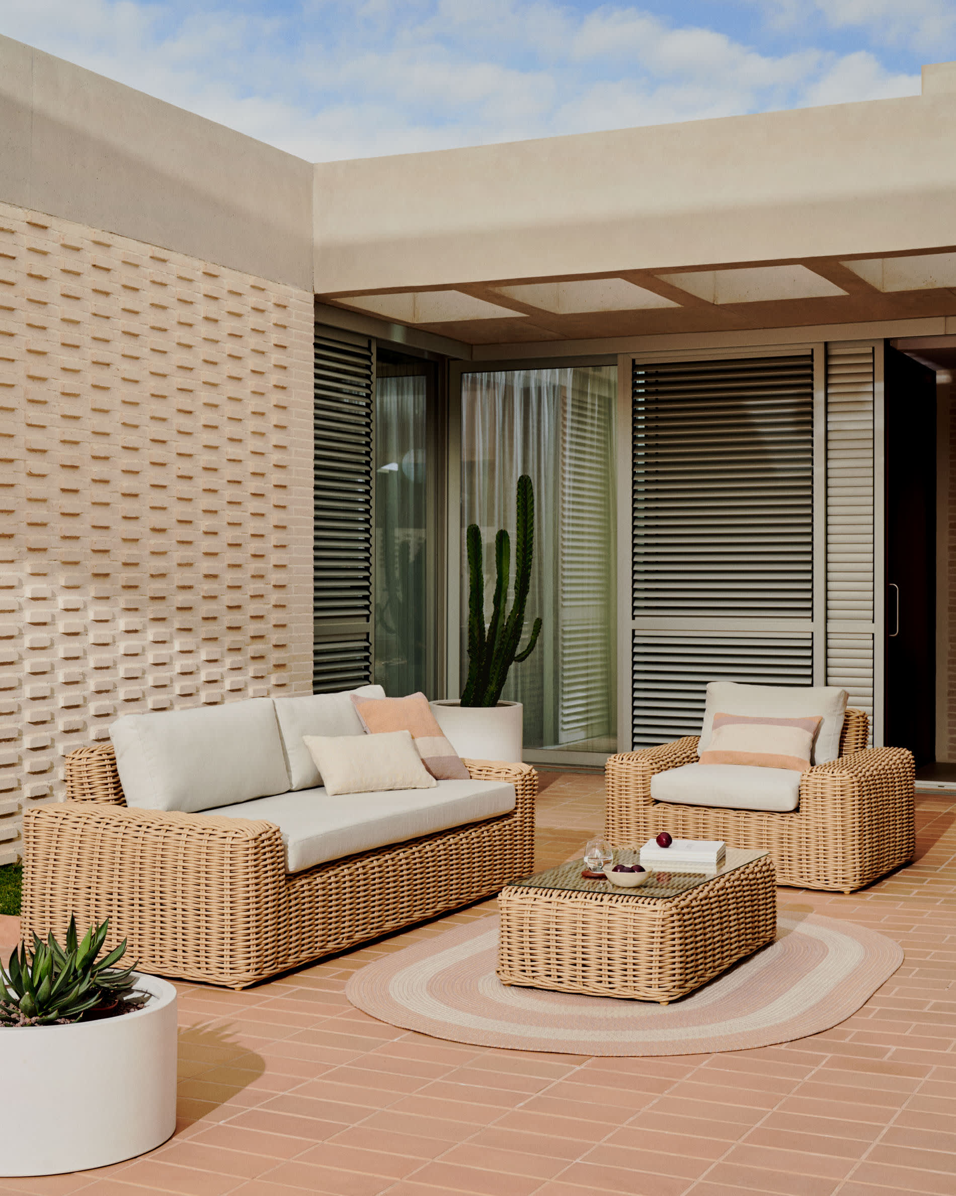 Portlligat 3 seater faux rattan outdoor sofa in a natural finish Kave Home