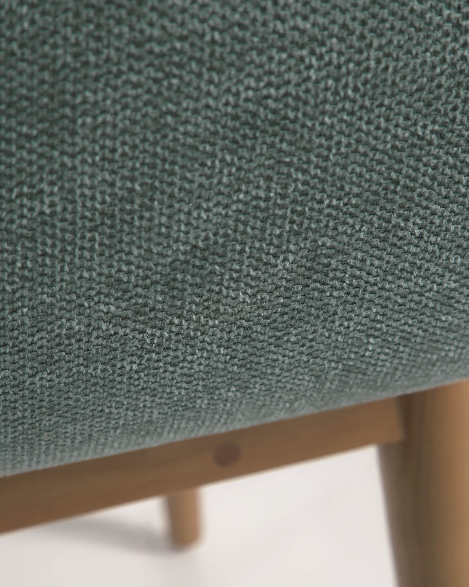 Konna chair in green with solid ash wood legs in a dark finish FR