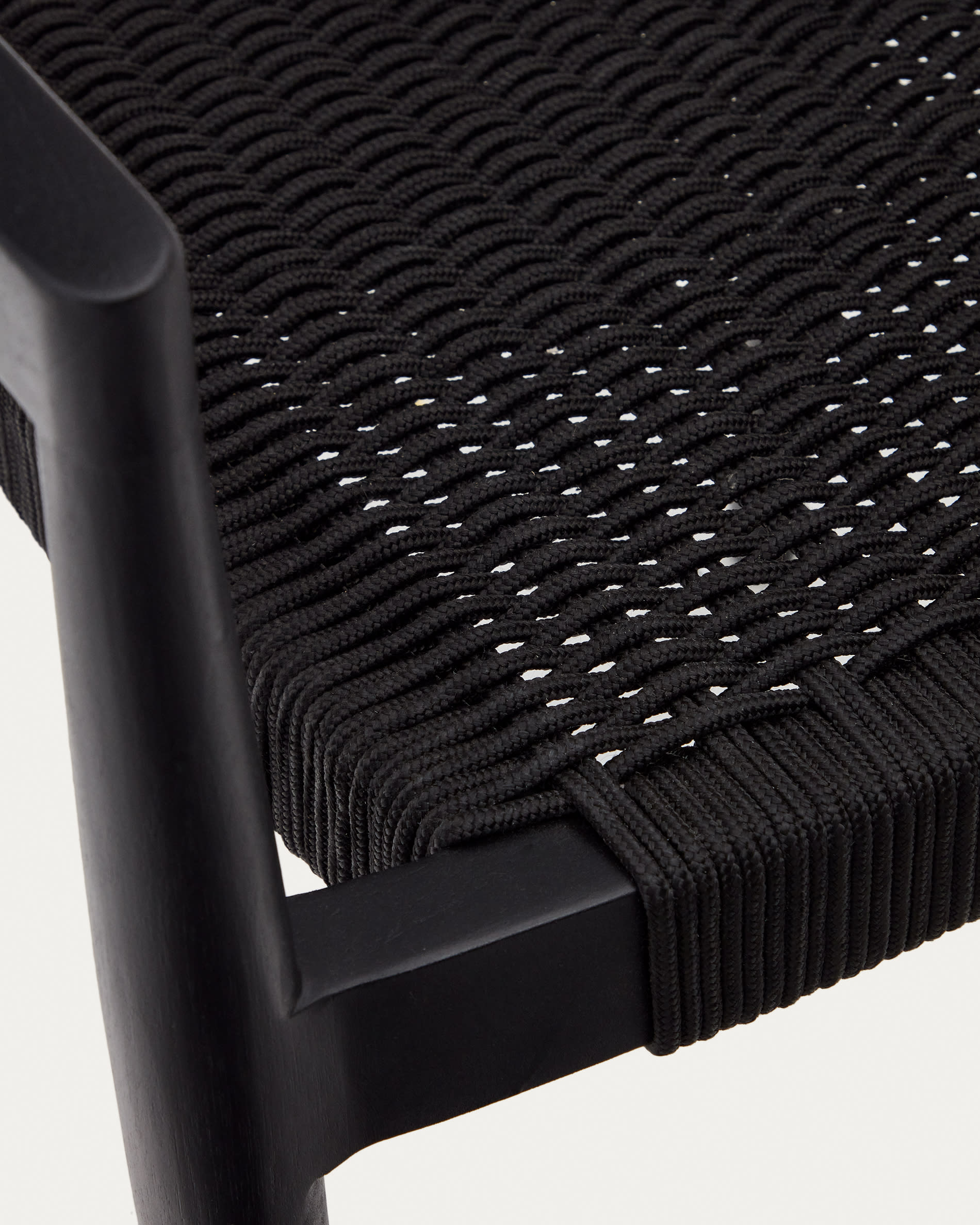 Ydalia stackable outdoor chair in solid teak wood with black finish and black rope