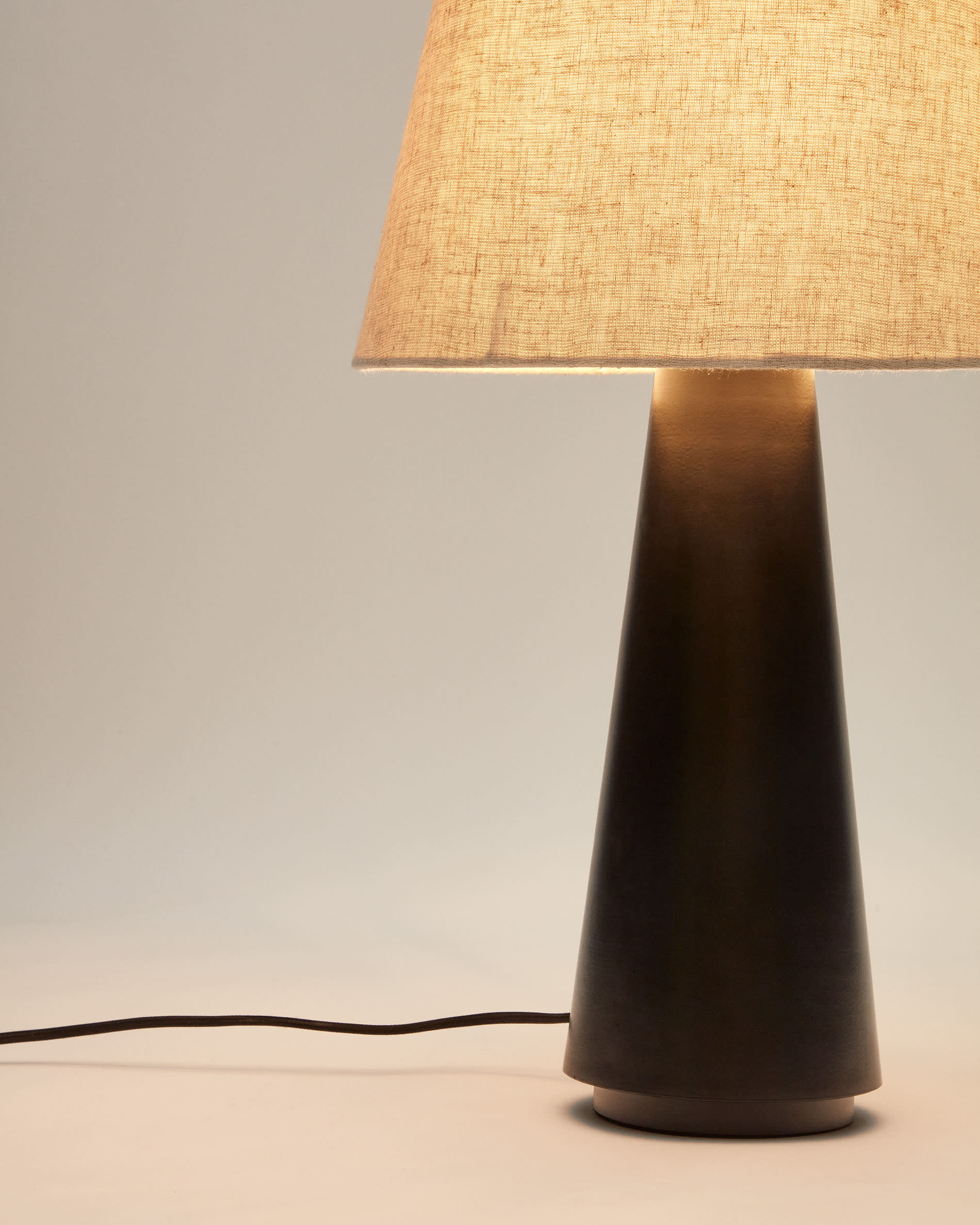 Torrent metal table lamp with black painted finish and linen shade