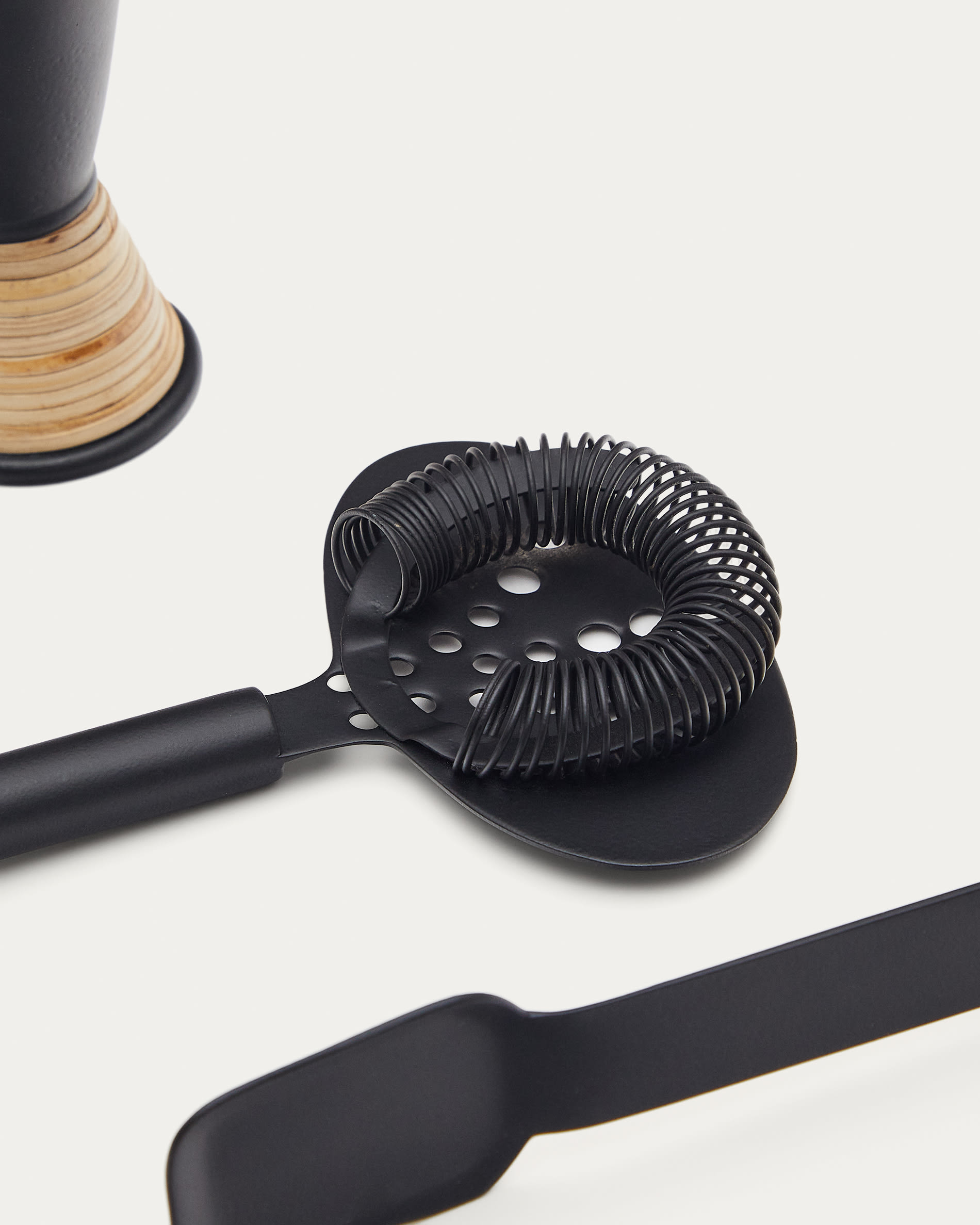 Shai set of black stainless steel and rattan cocktail utensils