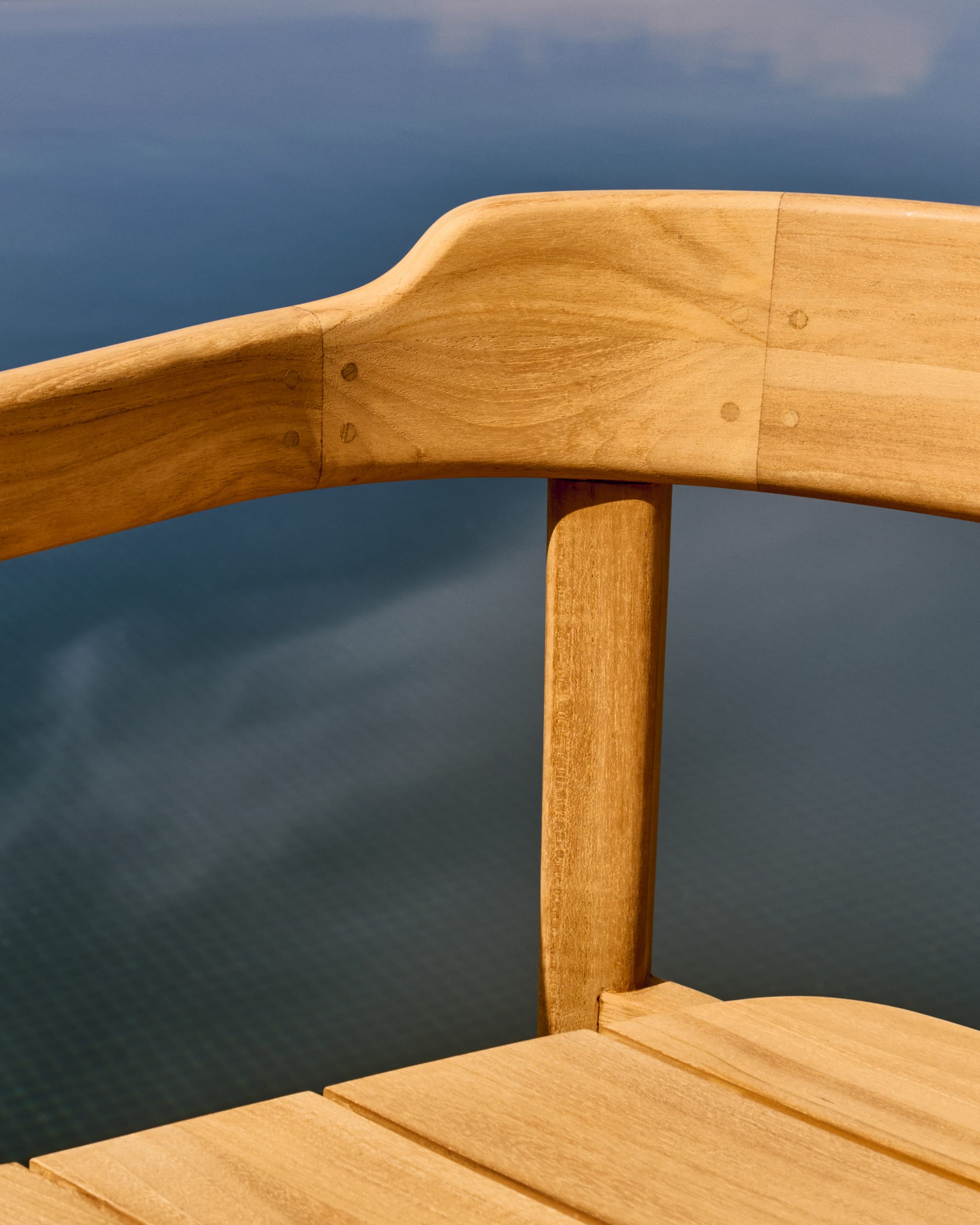 Icaro stackable chair in FSC 100% solid teak wood with natural finish