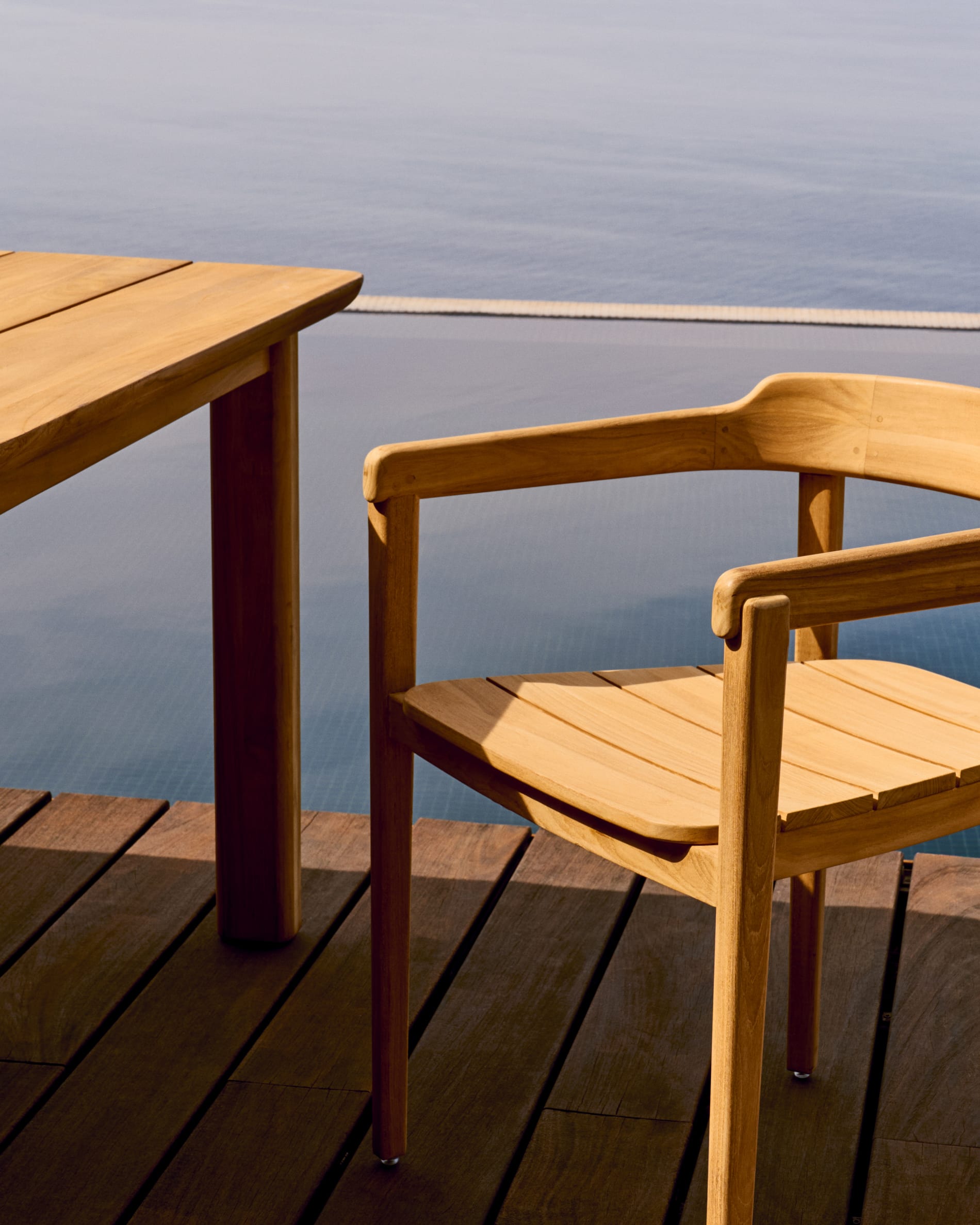 Icaro stackable chair in FSC 100% solid teak wood with natural finish