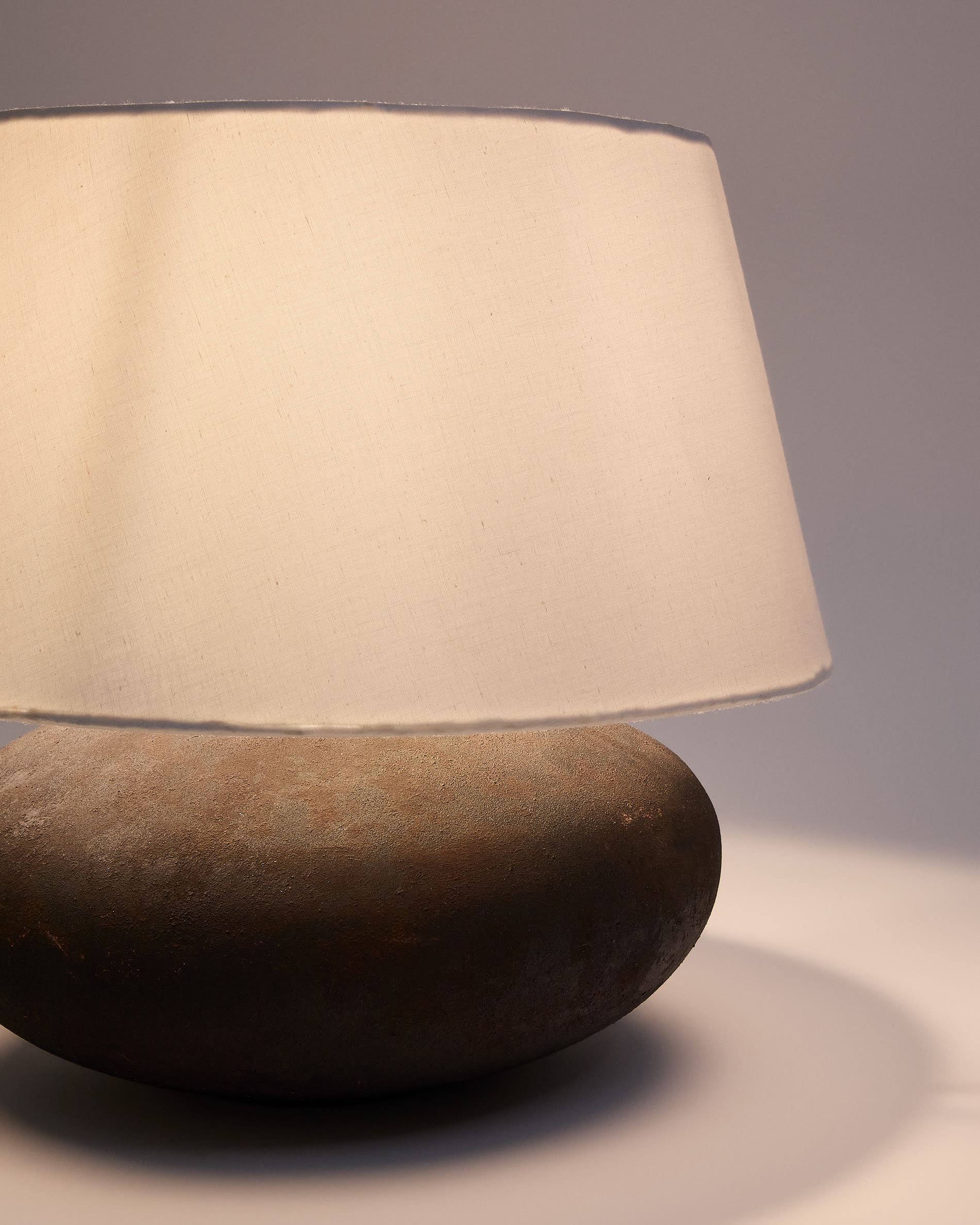 Nessi metal table lamp in a black terracotta effect finish
