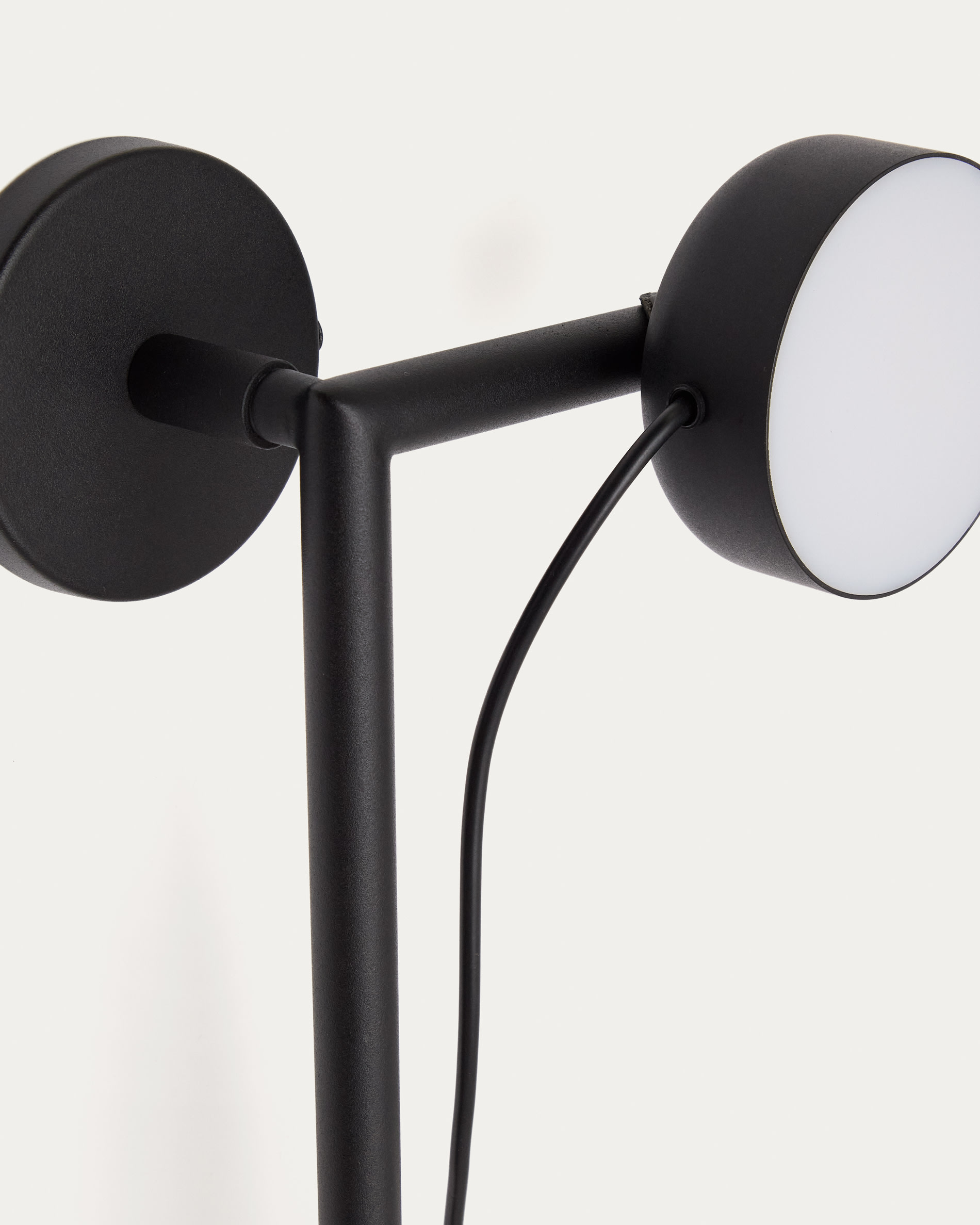 Orey black metal wall-mounted light fixture with multi-position spotlight