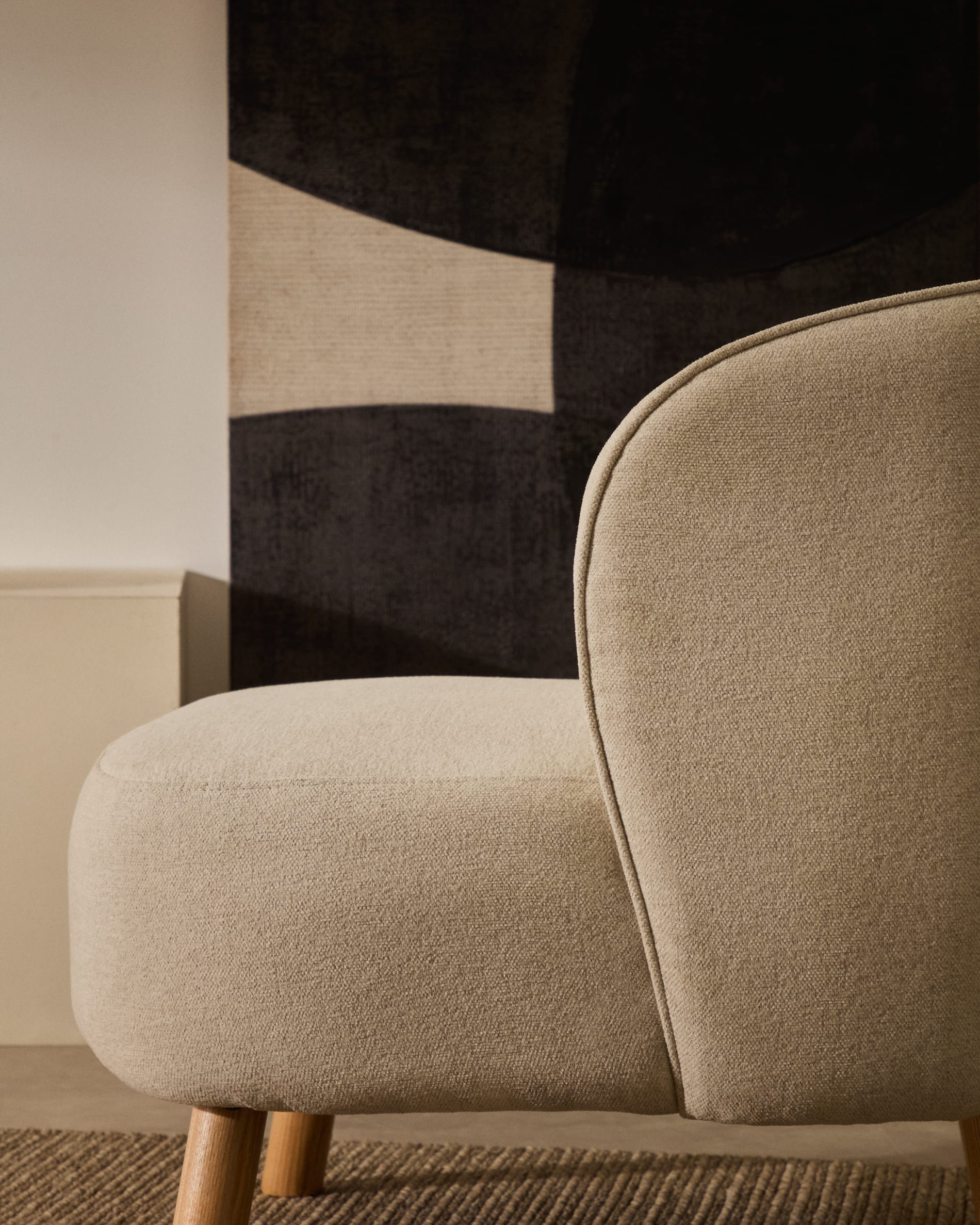 Ulit armchair in beige chenille with solid ash wood legs in a natural finish