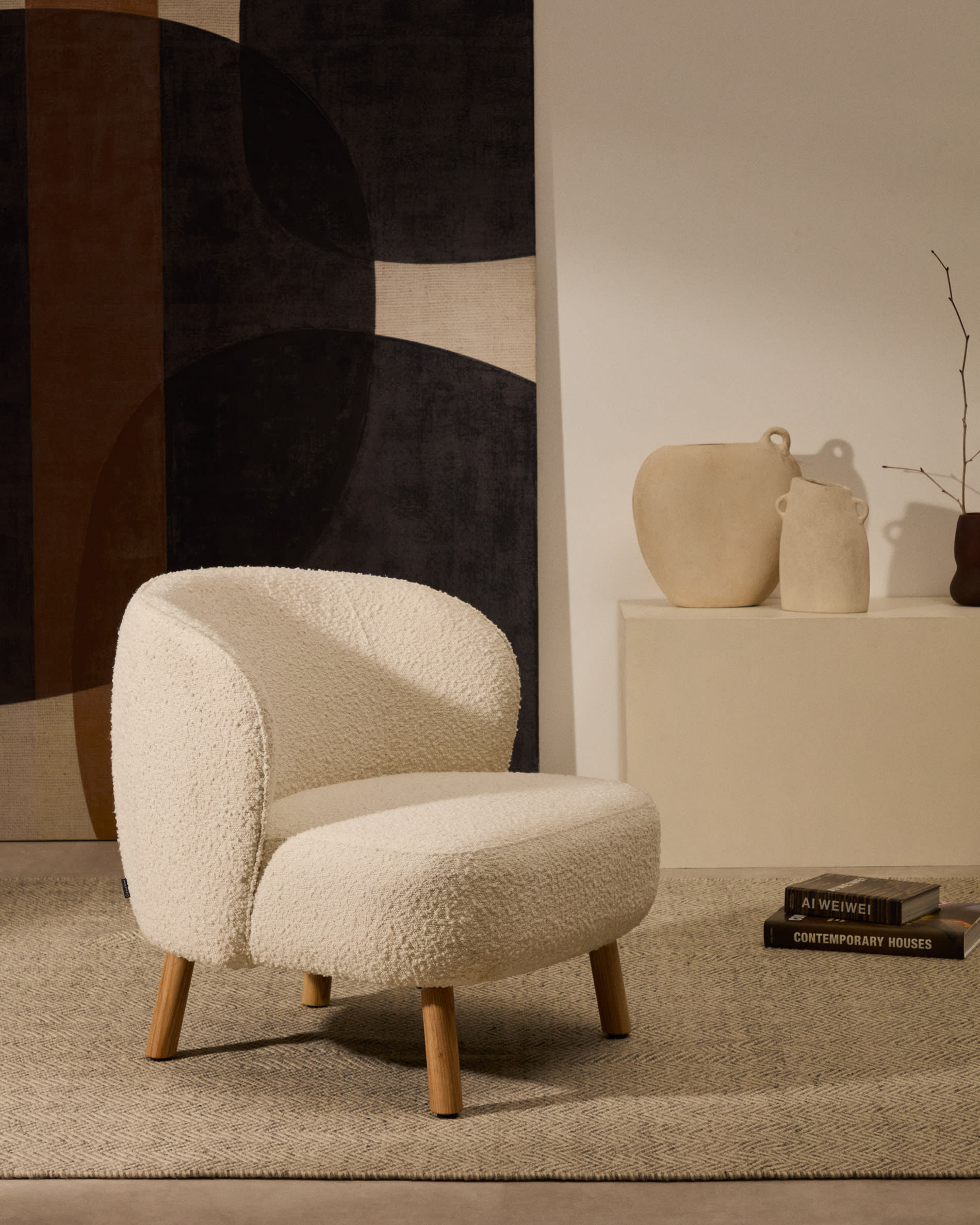 Ulit armchair in white bouclé with solid ash wood legs in a natural finish