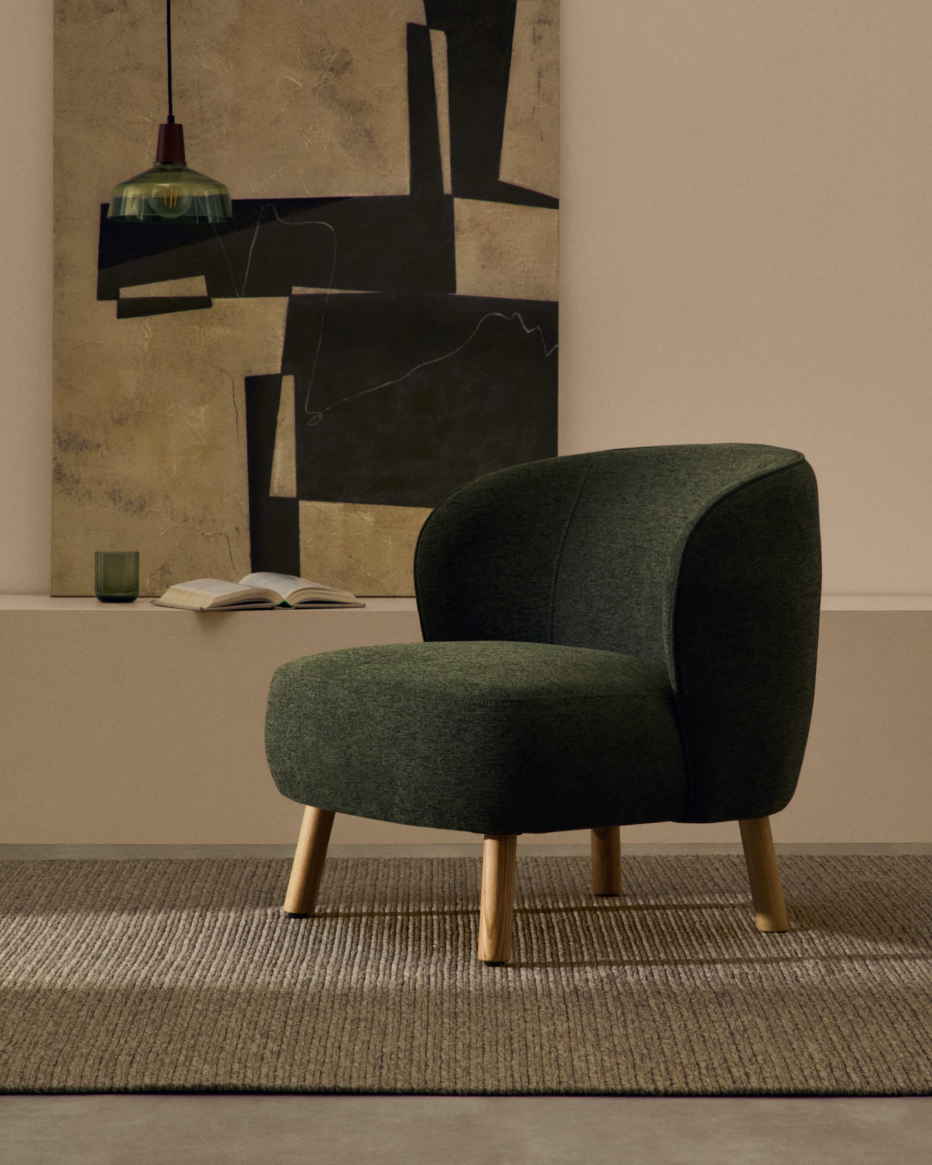 Ulit armchair in green chenille with solid ash wood legs in a natural finish