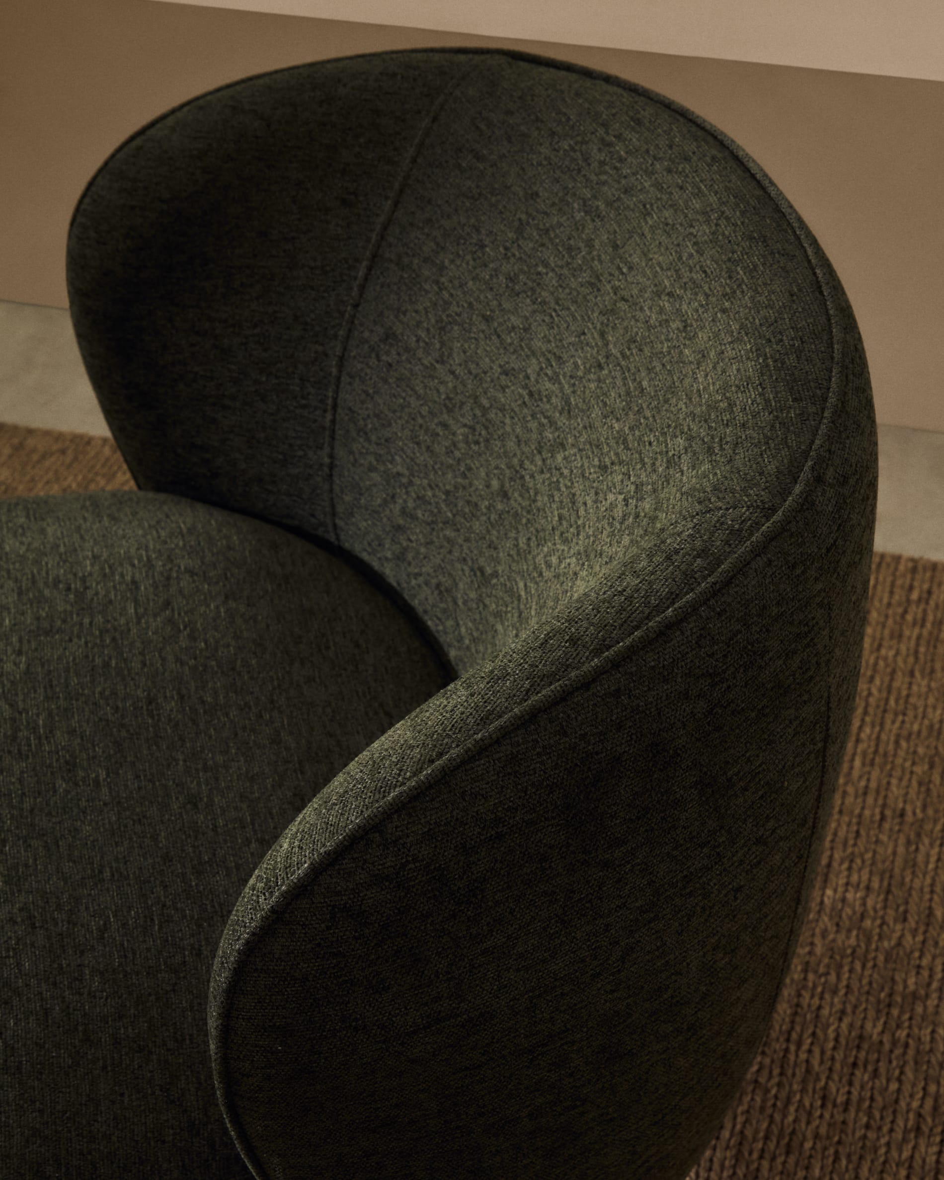 Ulit armchair in green chenille with solid ash wood legs in a natural finish