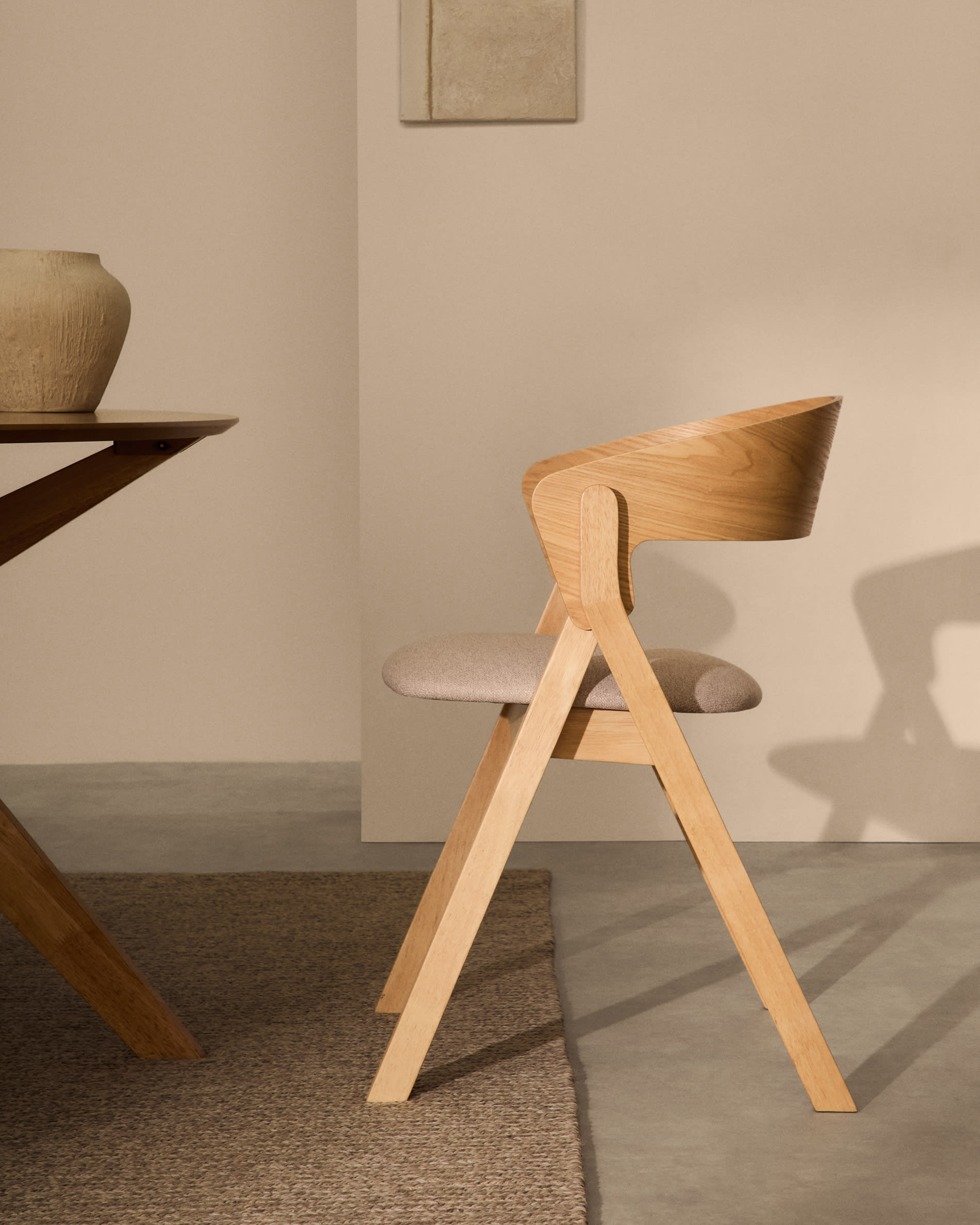 Godia chair in ash veneer with a natural finish and beige chenille