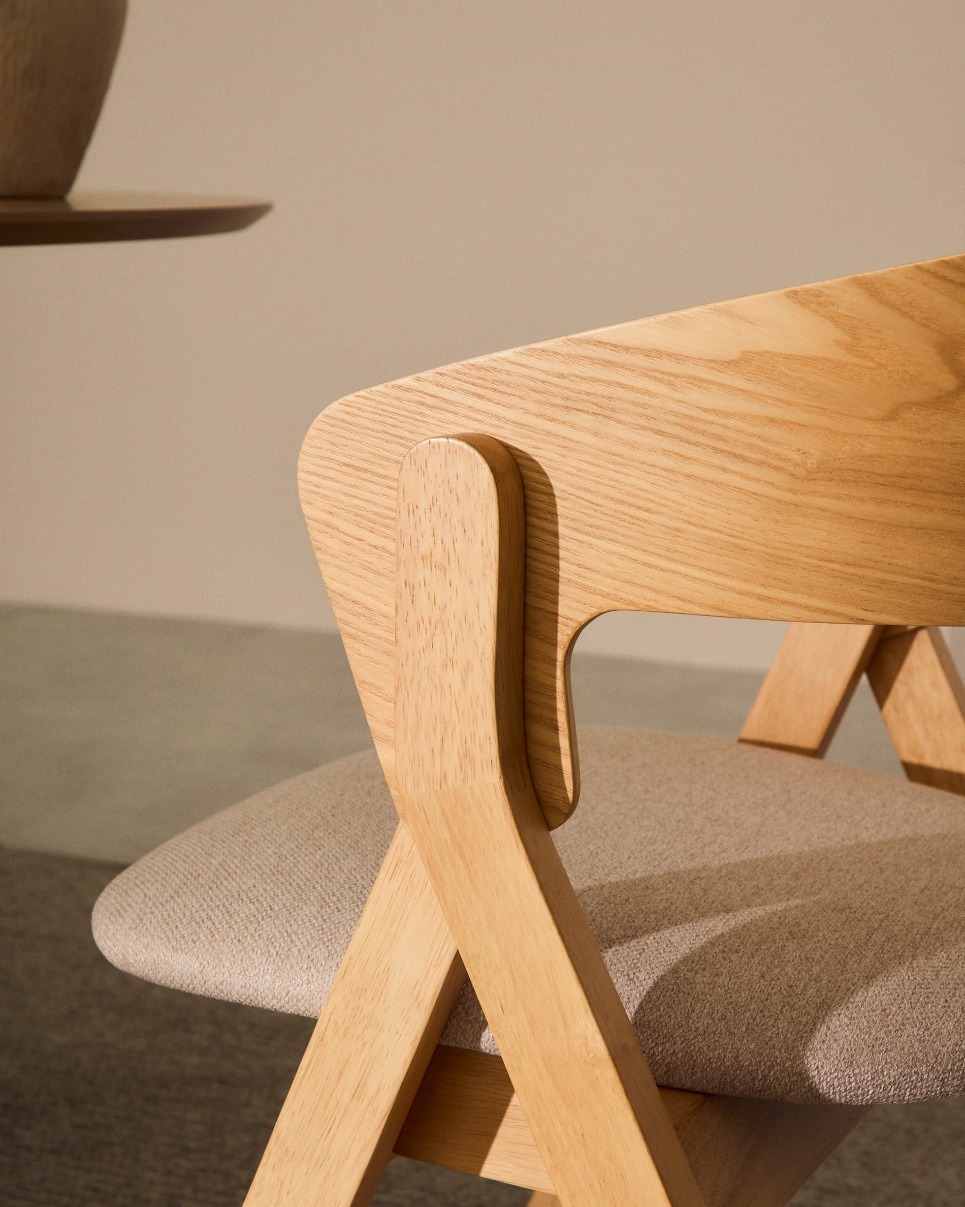 Godia chair in ash veneer with a natural finish and beige chenille