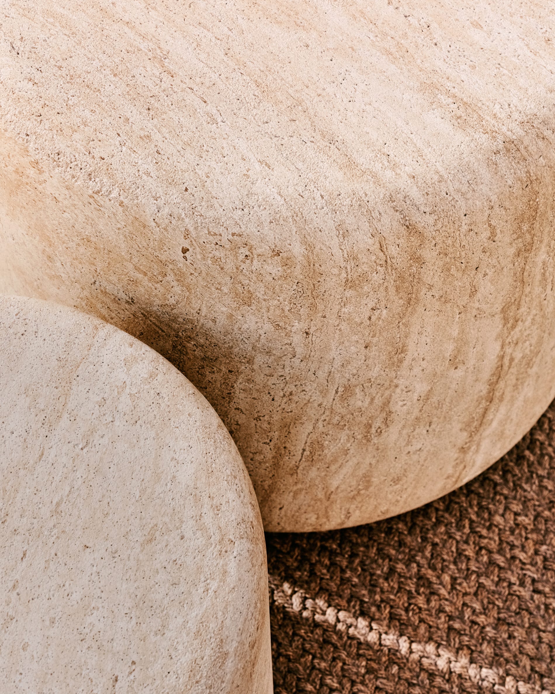 Drasi cement side table with travertine-effect finish Ø46cm