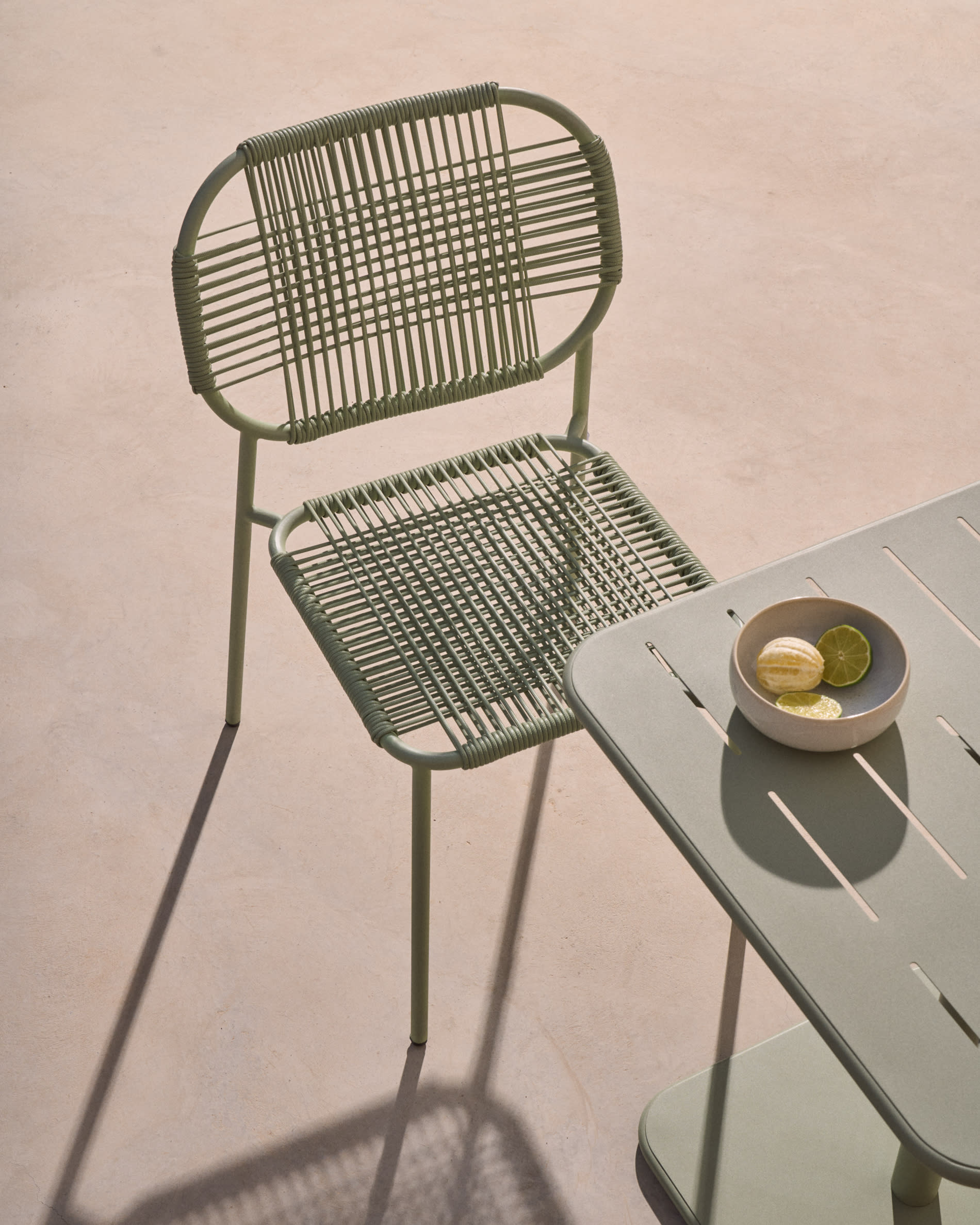 Talaier stackable outdoor chair in synthetic rope and galvanised steel with turquoise finish