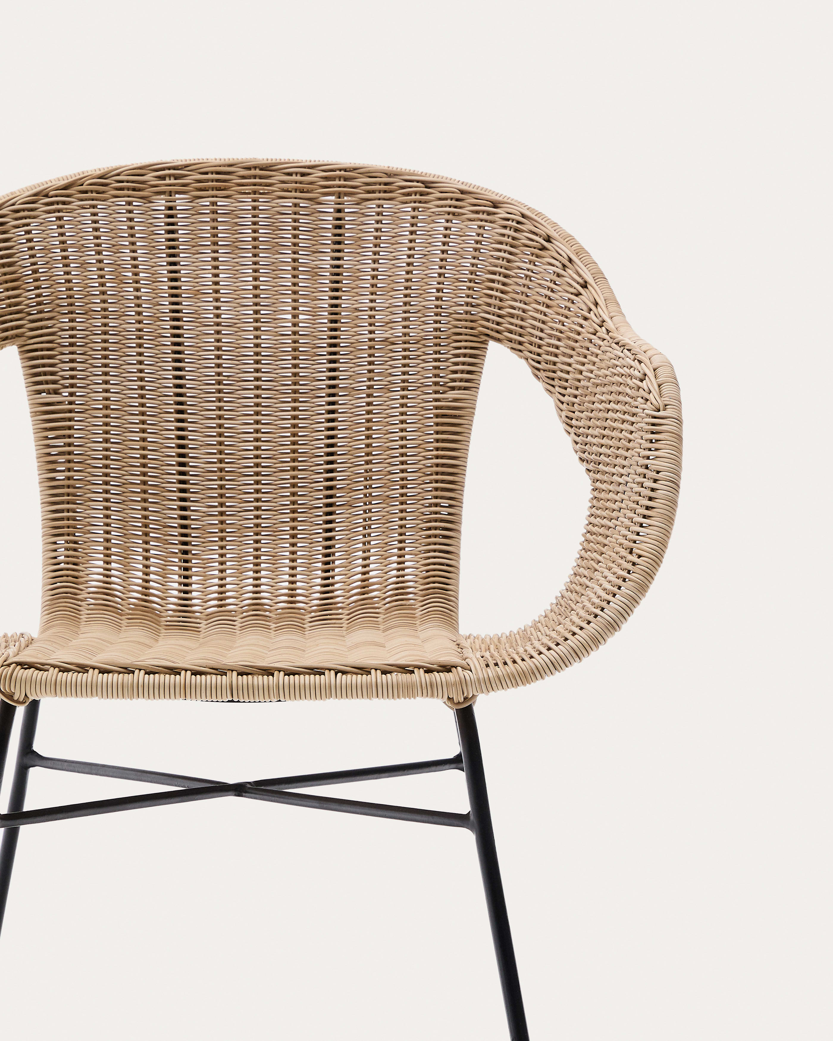 Eltiera stackable chair in synthetic rattan with black steel frame