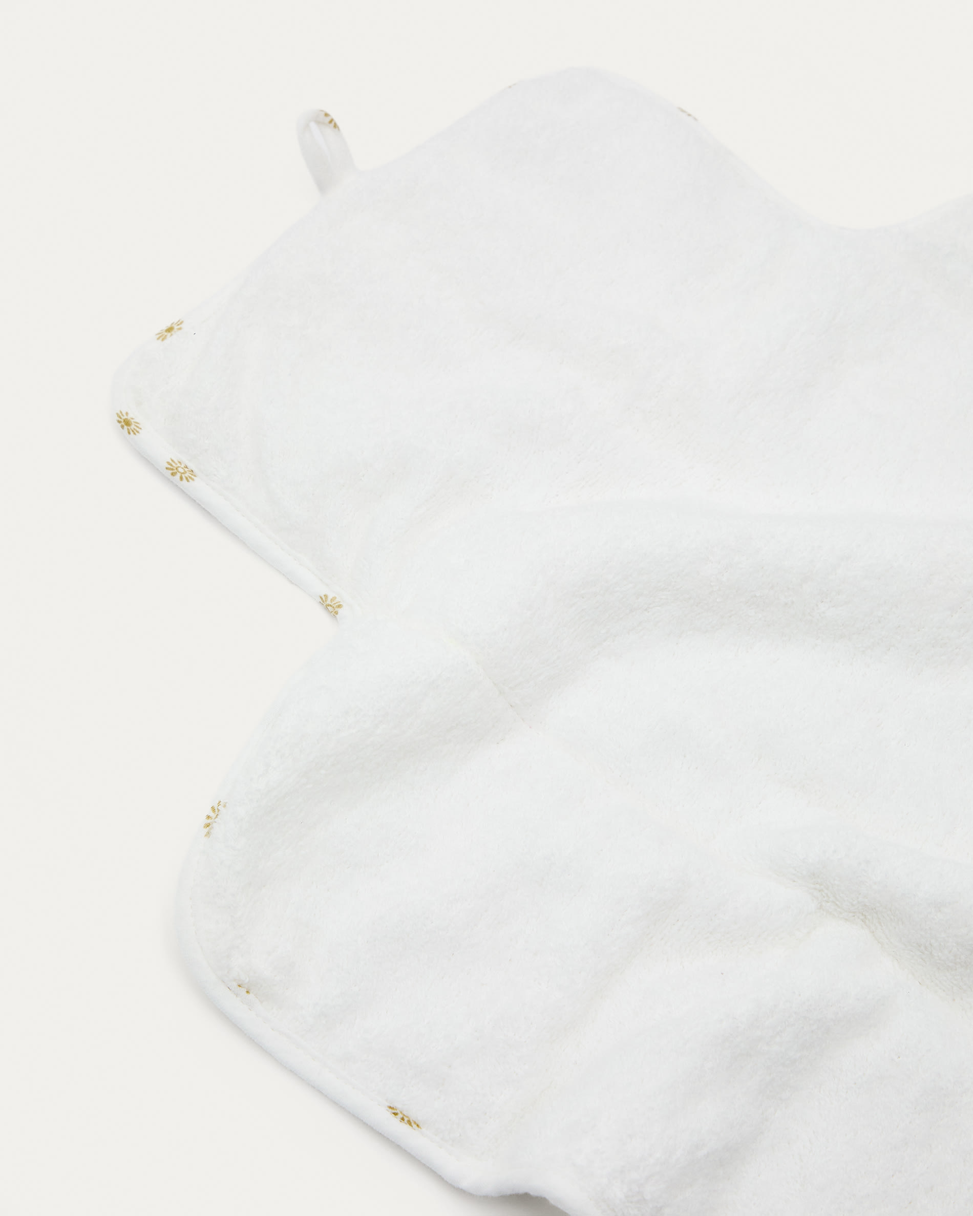 Olna travel changing mat in 100% cotton with a sun print