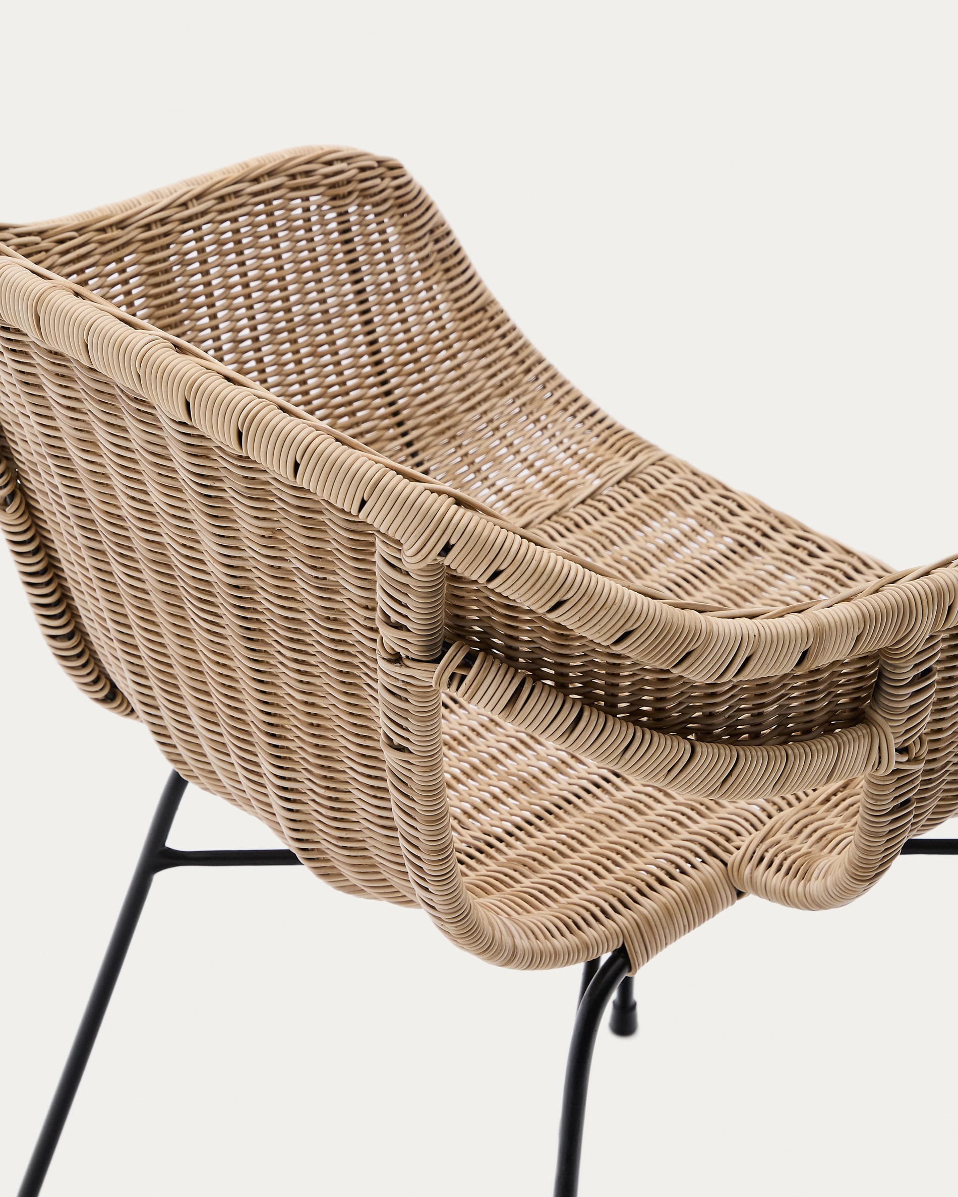 Eltiera stackable chair in synthetic rattan with black steel frame