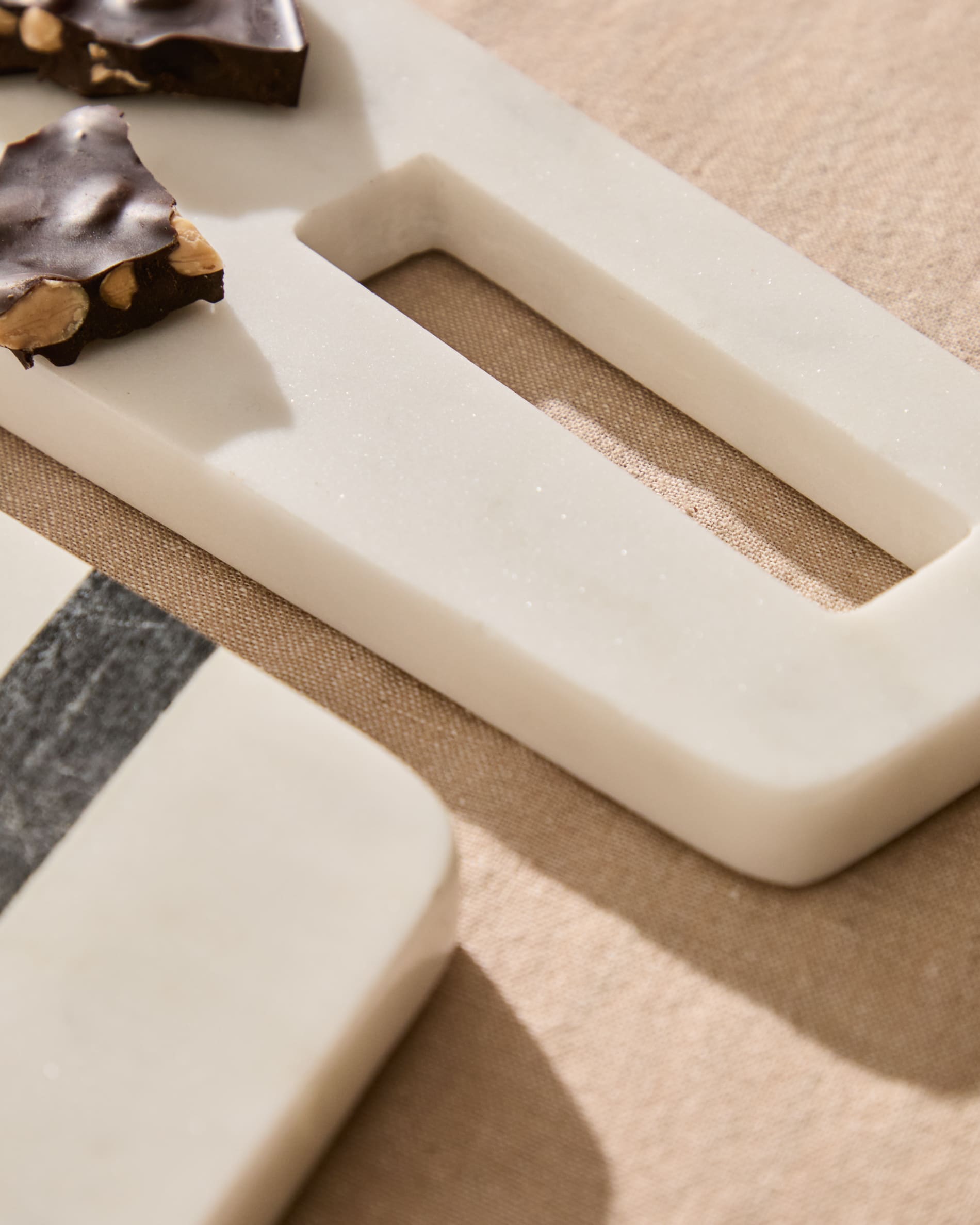 Nira small serving board in white and grey marble