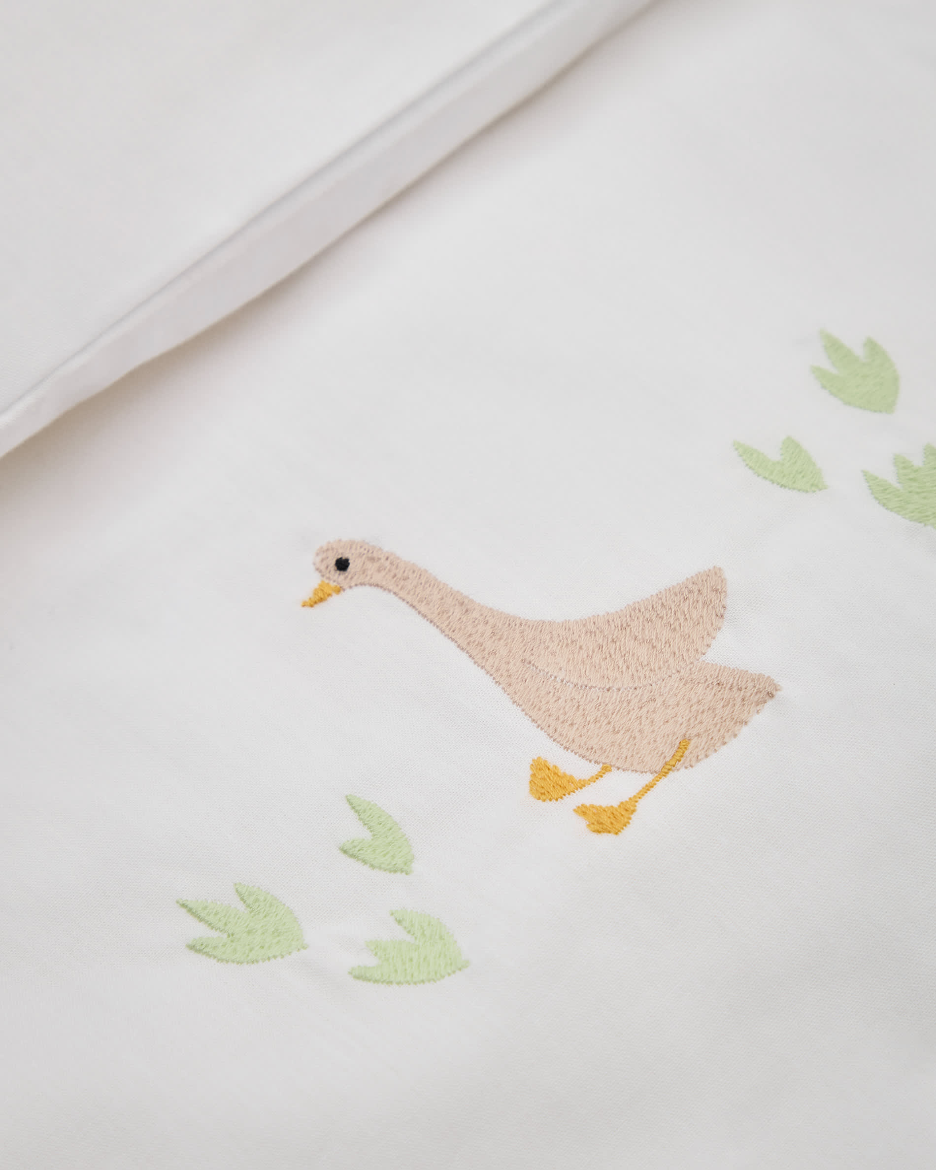 Milu set of duvet cover and pillow cases with embroidered goose for convertible cot and bed 70 x 140 cm