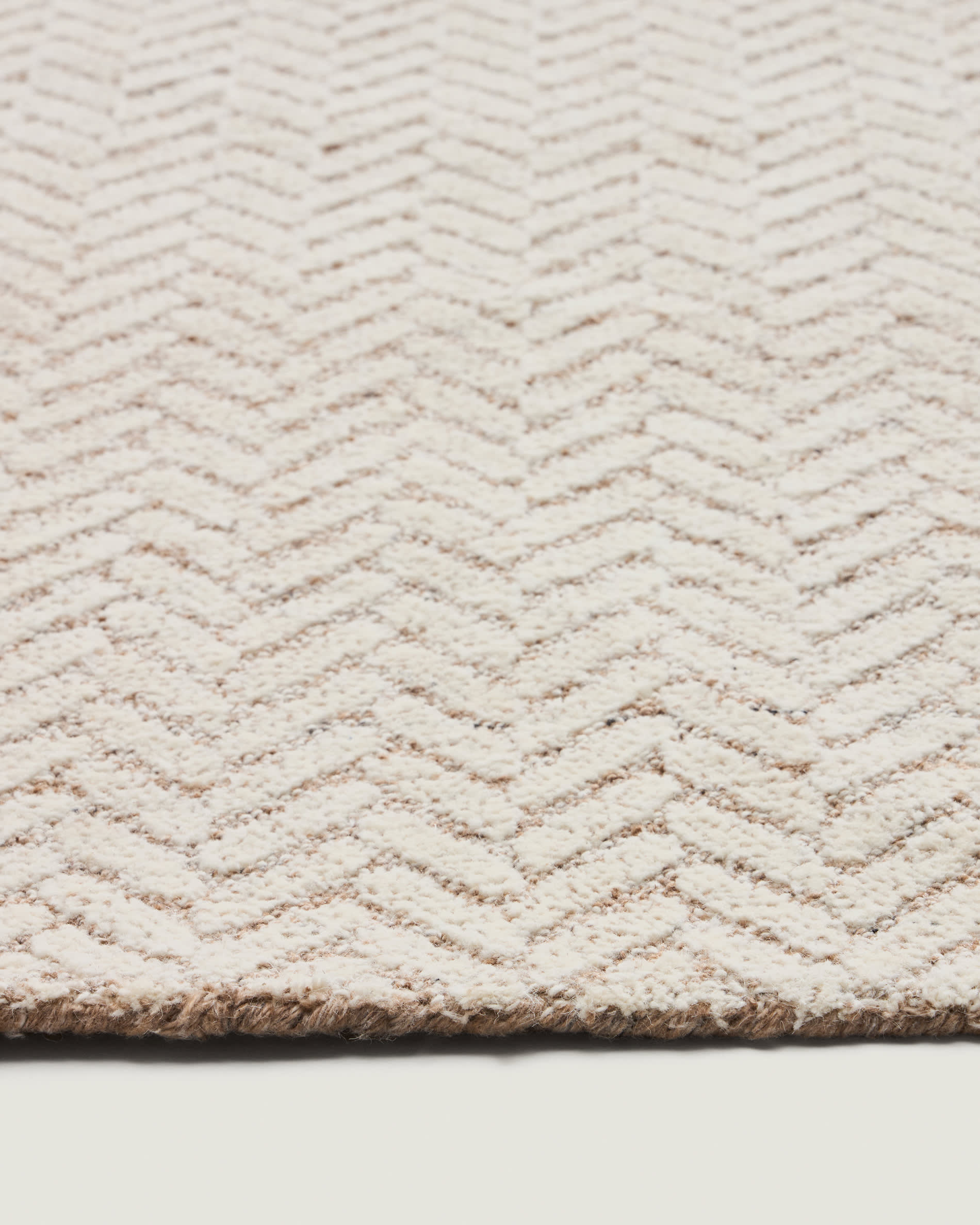 Calira beige woven jacquard wool rug 300 x 200cm