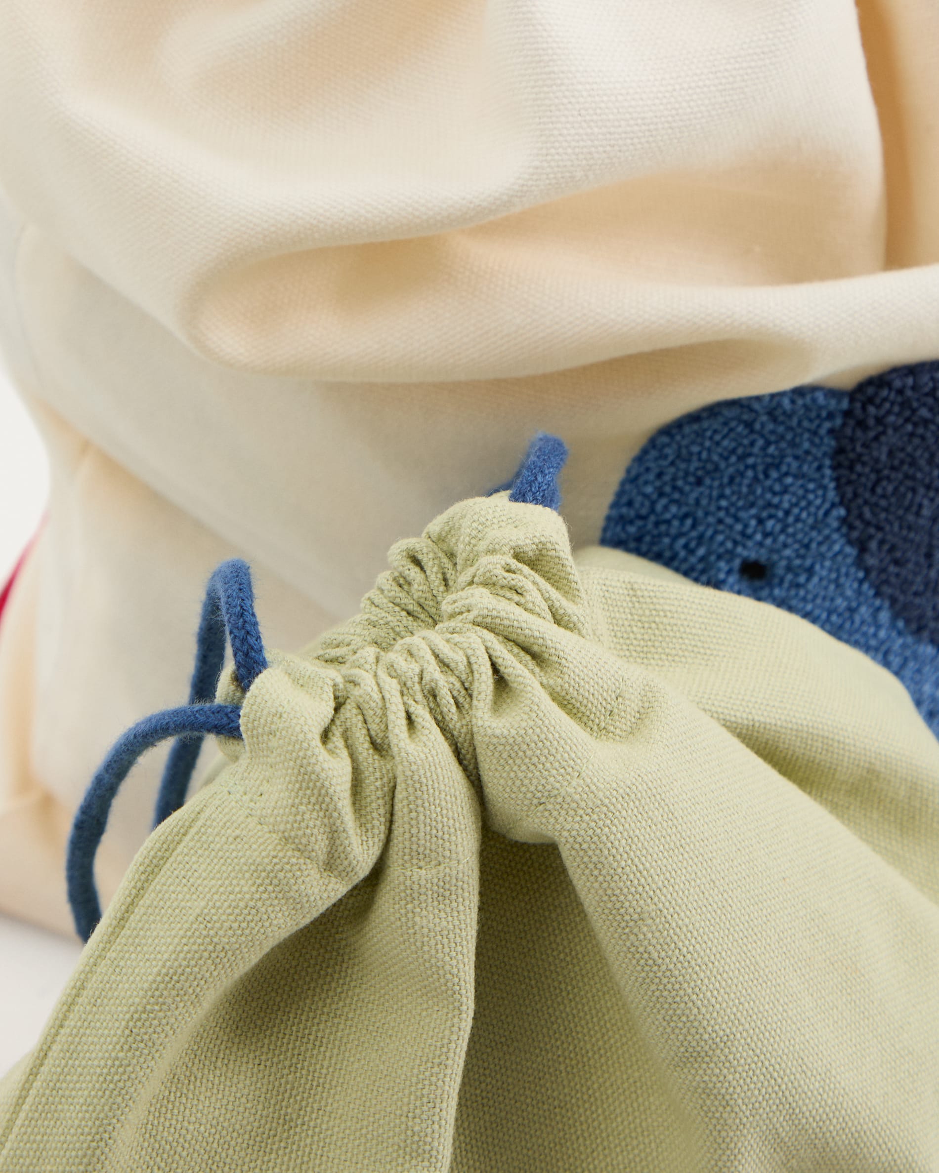 Tandani set of 2 beige and green cotton bags with embroidered blue elephant
