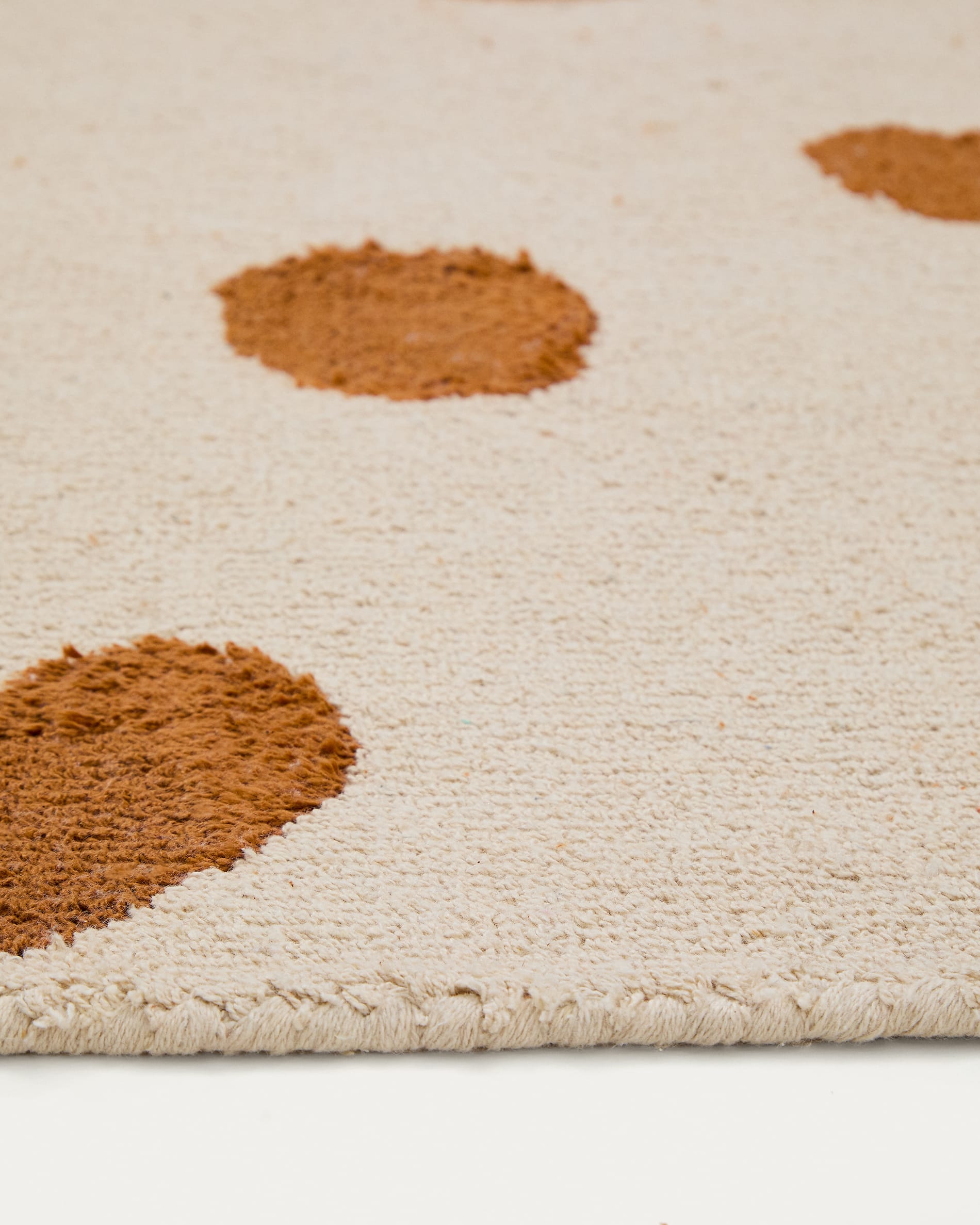 Tandani beige cotton rug with orange cheetah design 90 x 150cm