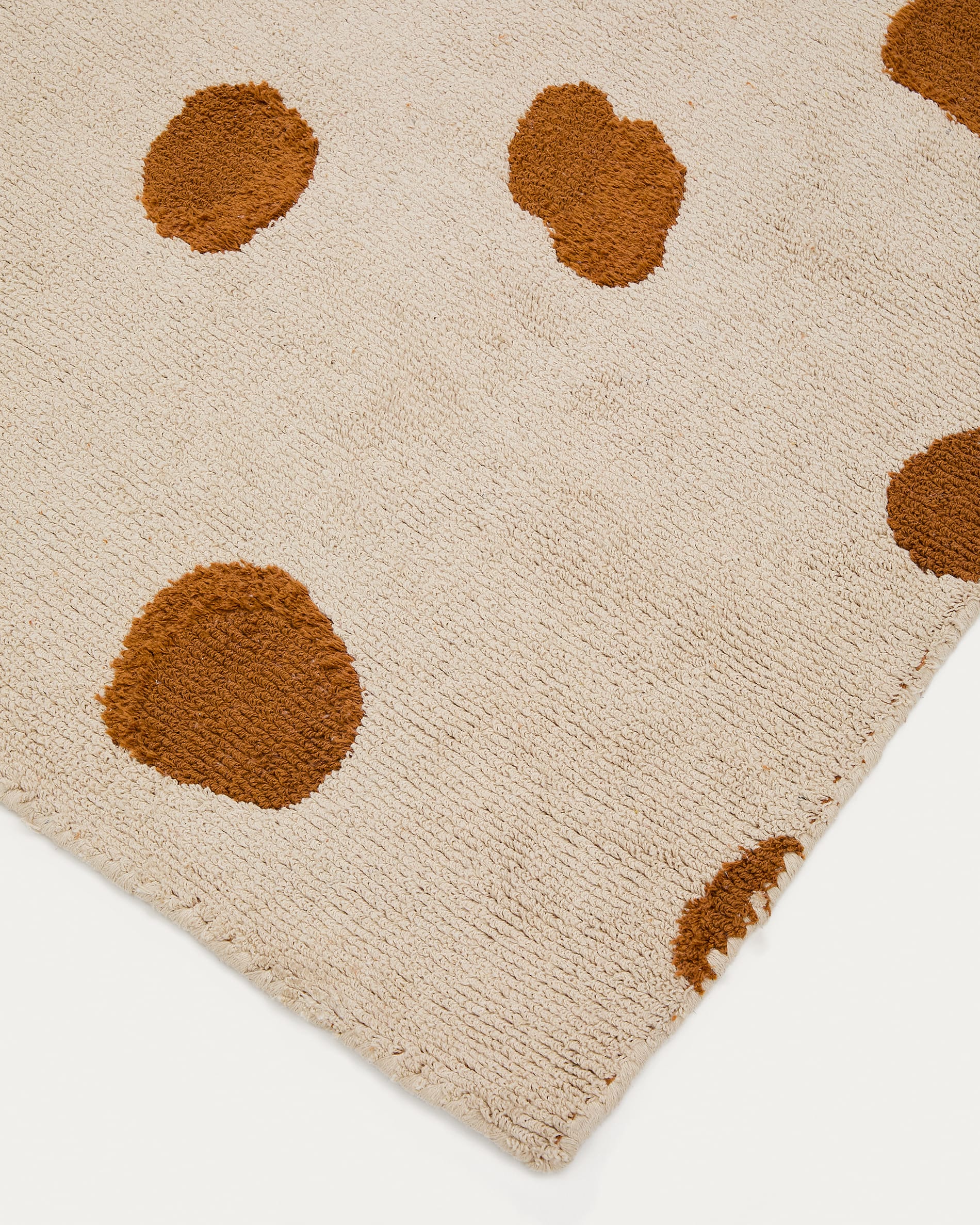 Tandani beige cotton rug with orange cheetah design 90 x 150cm