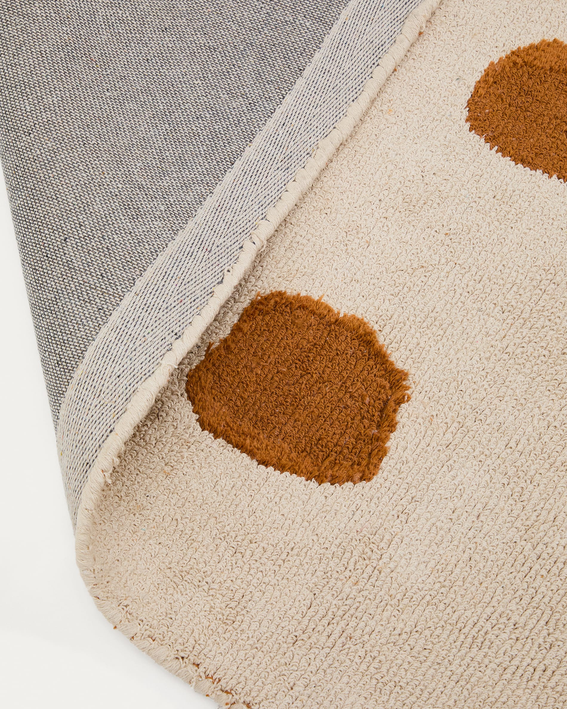 Tandani beige cotton rug with orange cheetah design 90 x 150cm