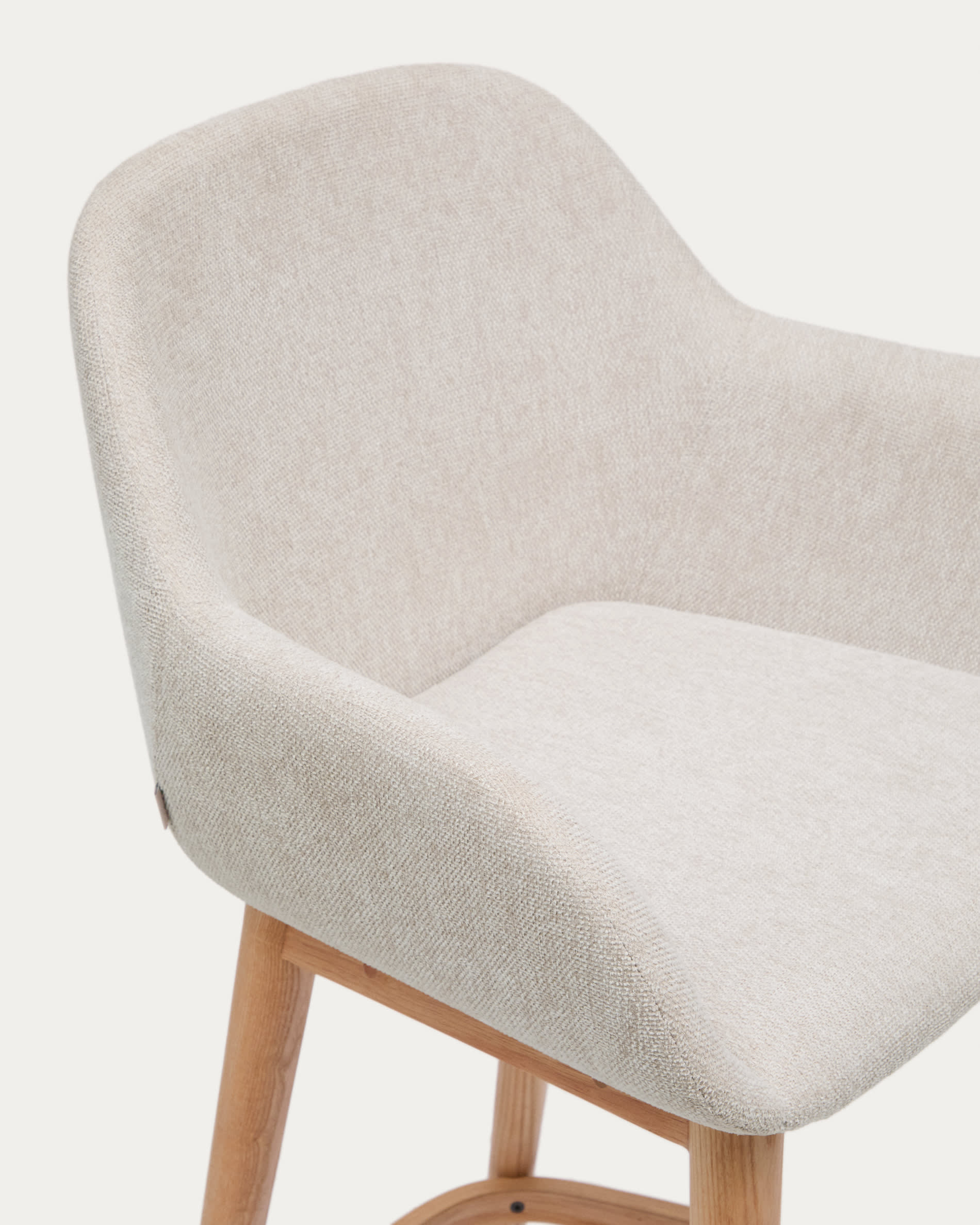 Konna stool in beige and solid ash wood legs in a light finish, 65 cm