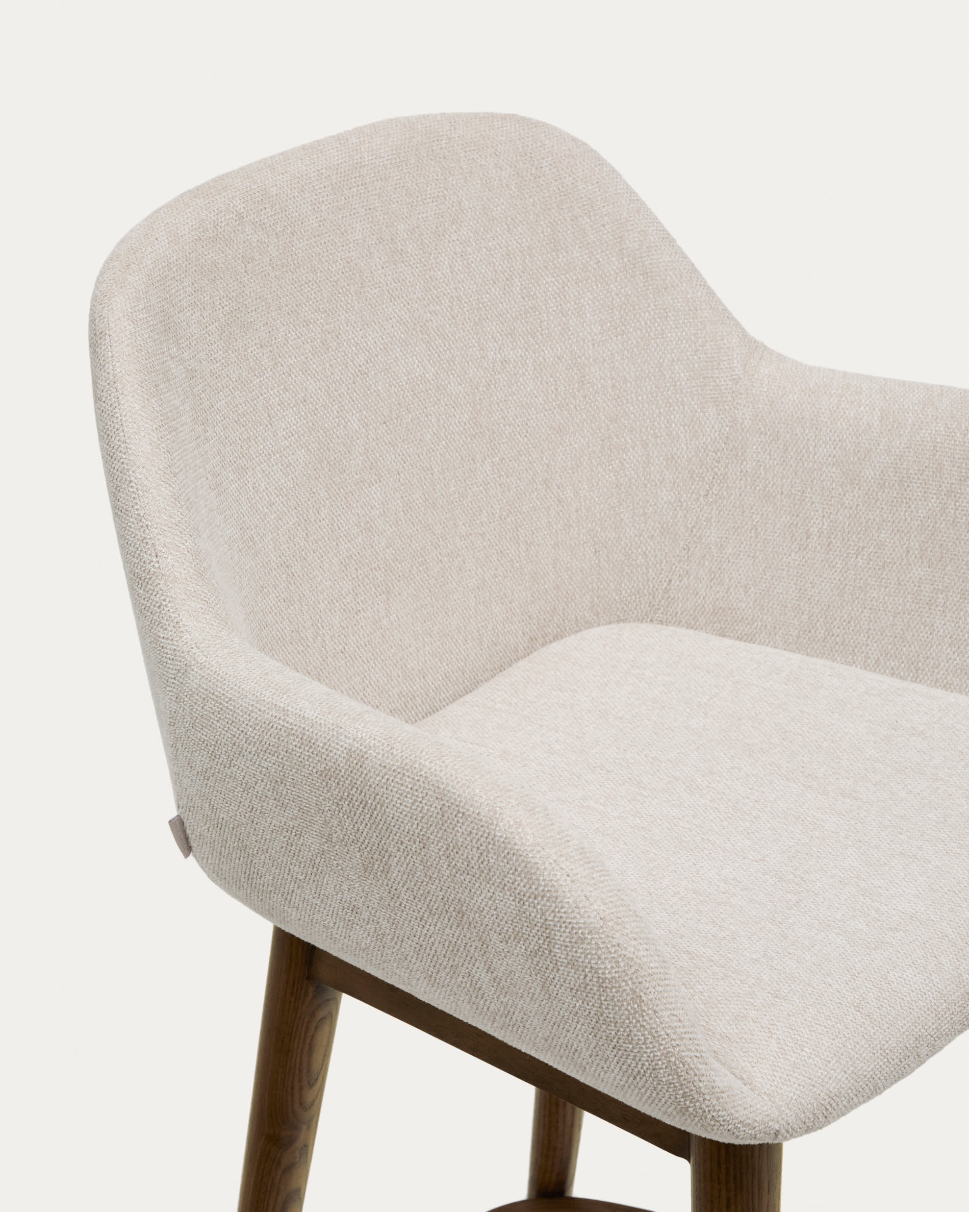 Konna stool in beige and solid ash wood legs in a dark finish, 65 cm