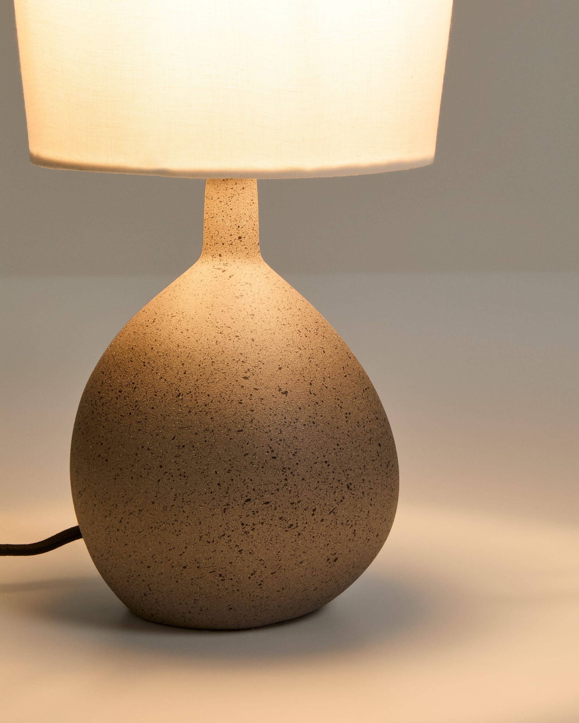 Viona small table lamp with textured stone effect and cotton lampshade