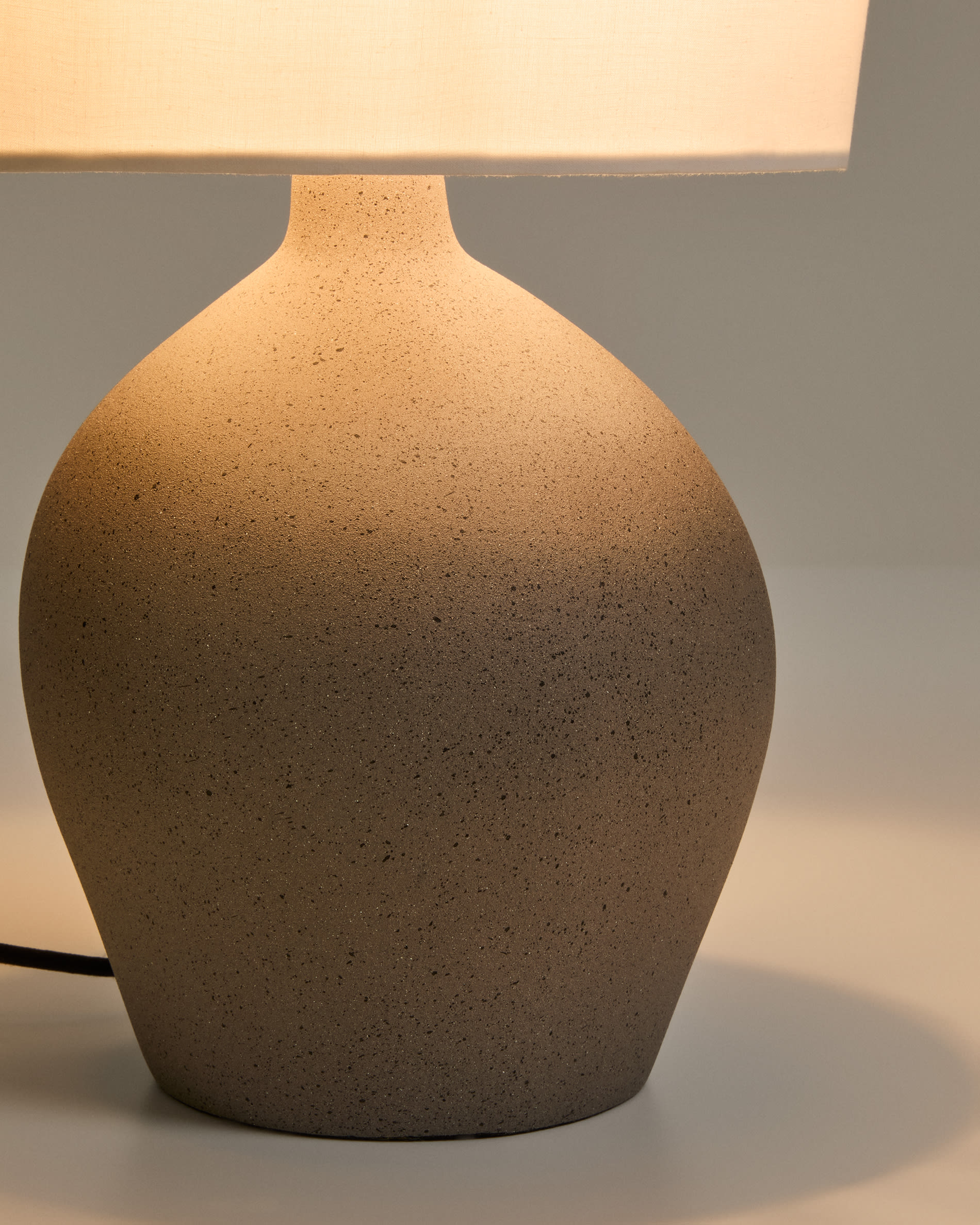 Viona medium table lamp with textured stone effect and cotton lampshade