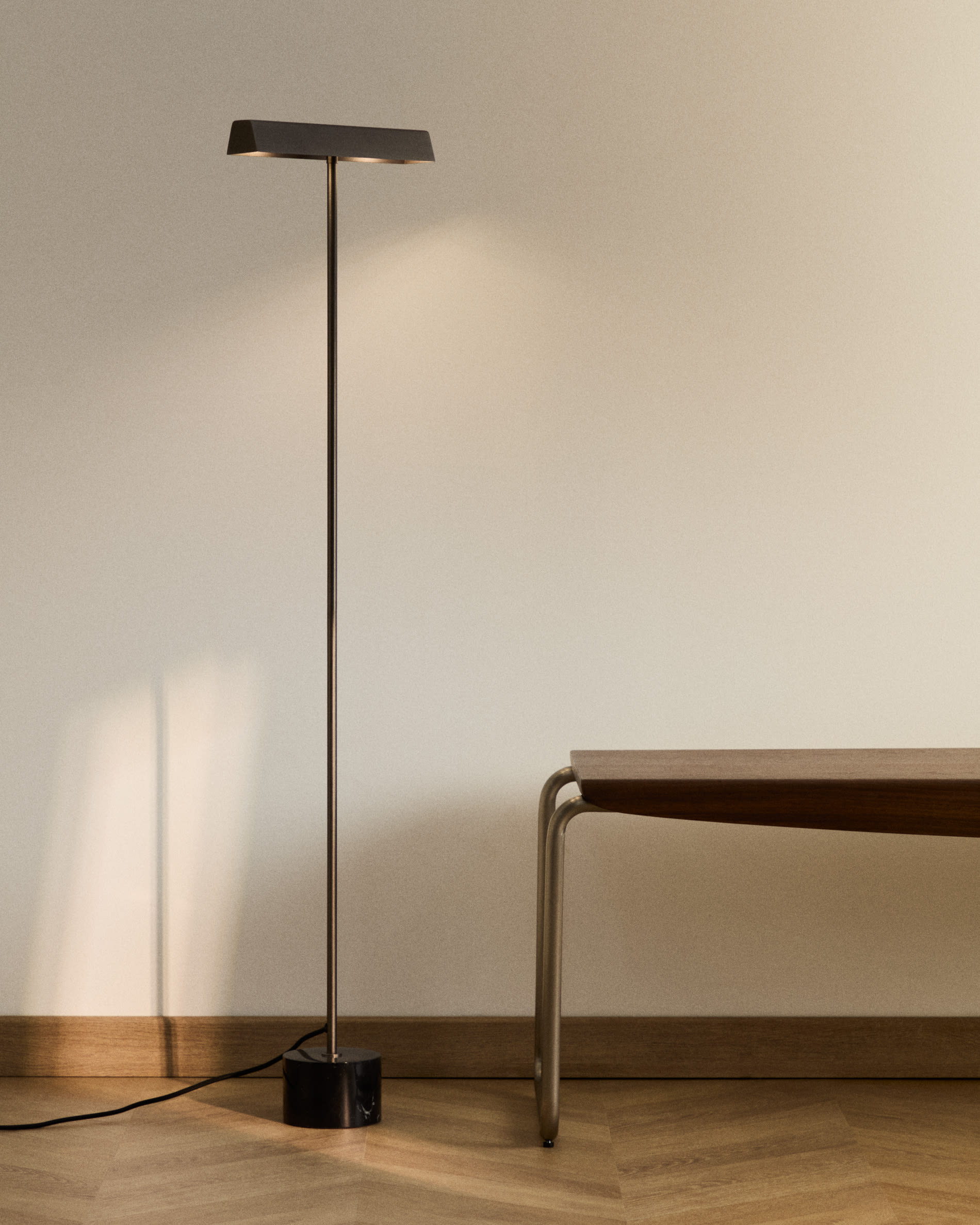 Lynor brushed steel floor lamp with black marble base
