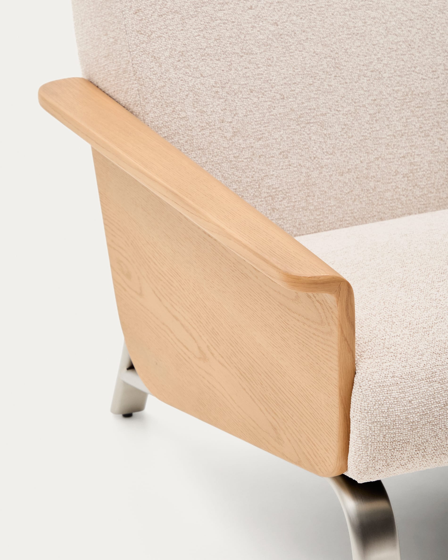 Amsen beige armchair in oak plywood with legs in brushed stainless steel
