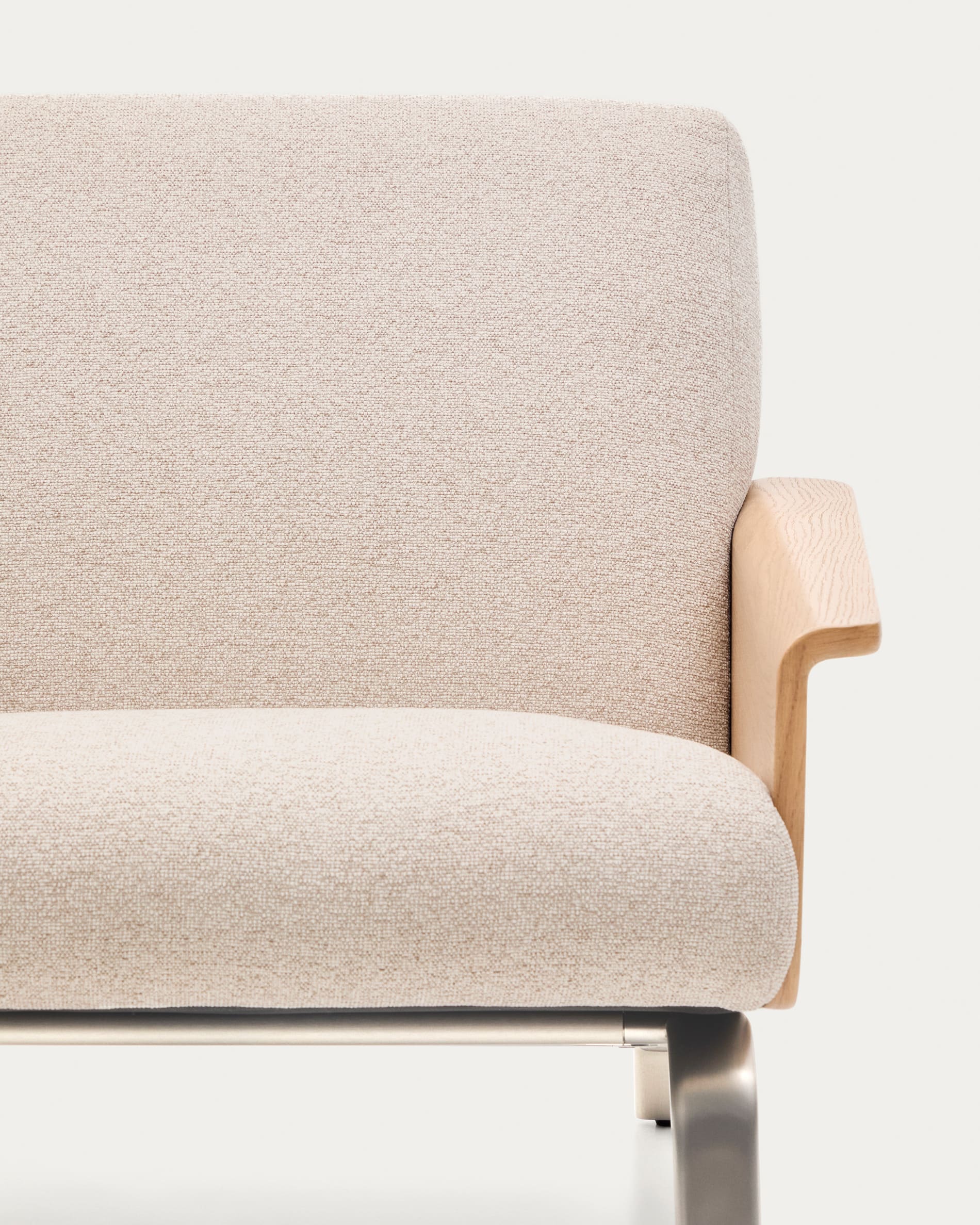 Amsen beige armchair in oak plywood with legs in brushed stainless steel
