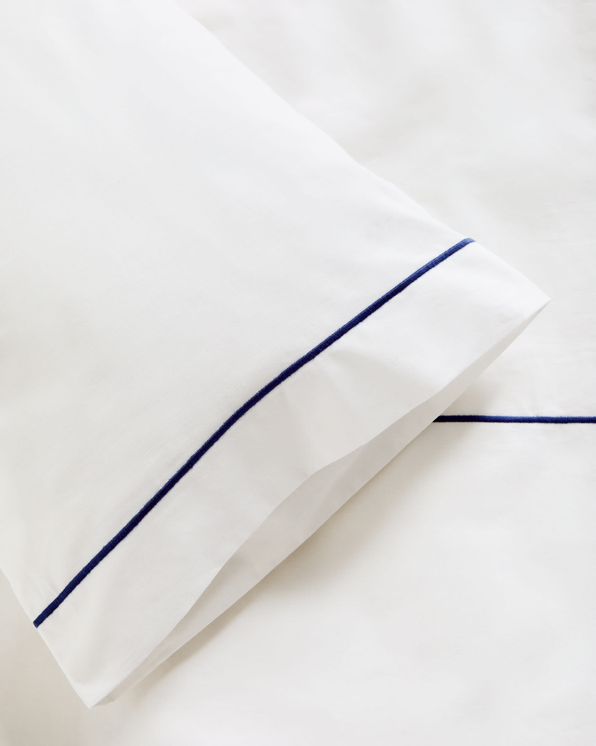 Tandari duvet cover and pillowcase set in beige cotton percale with embroidered elephant for convertible cot