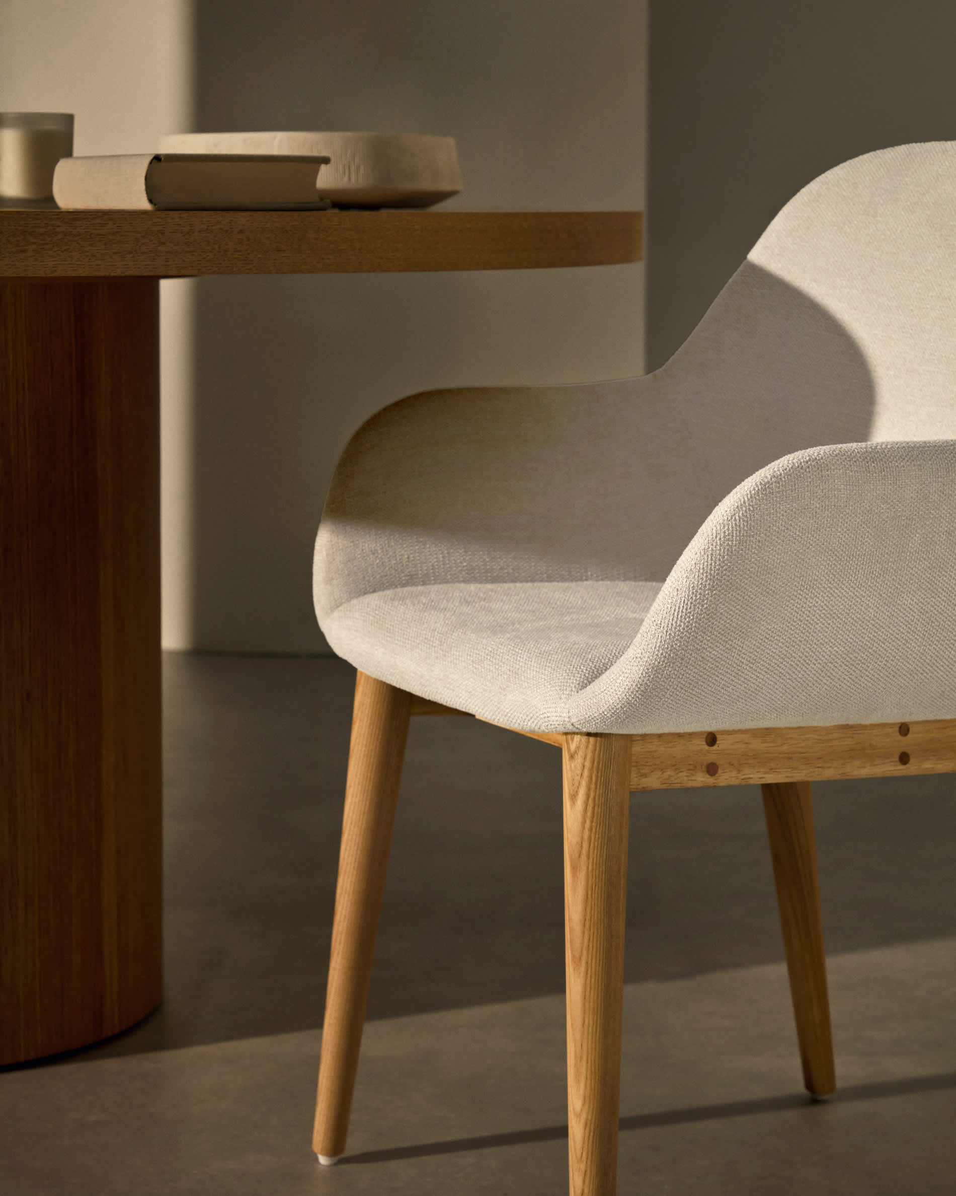 Konna chair in beige with solid ash wood legs in a natural finish