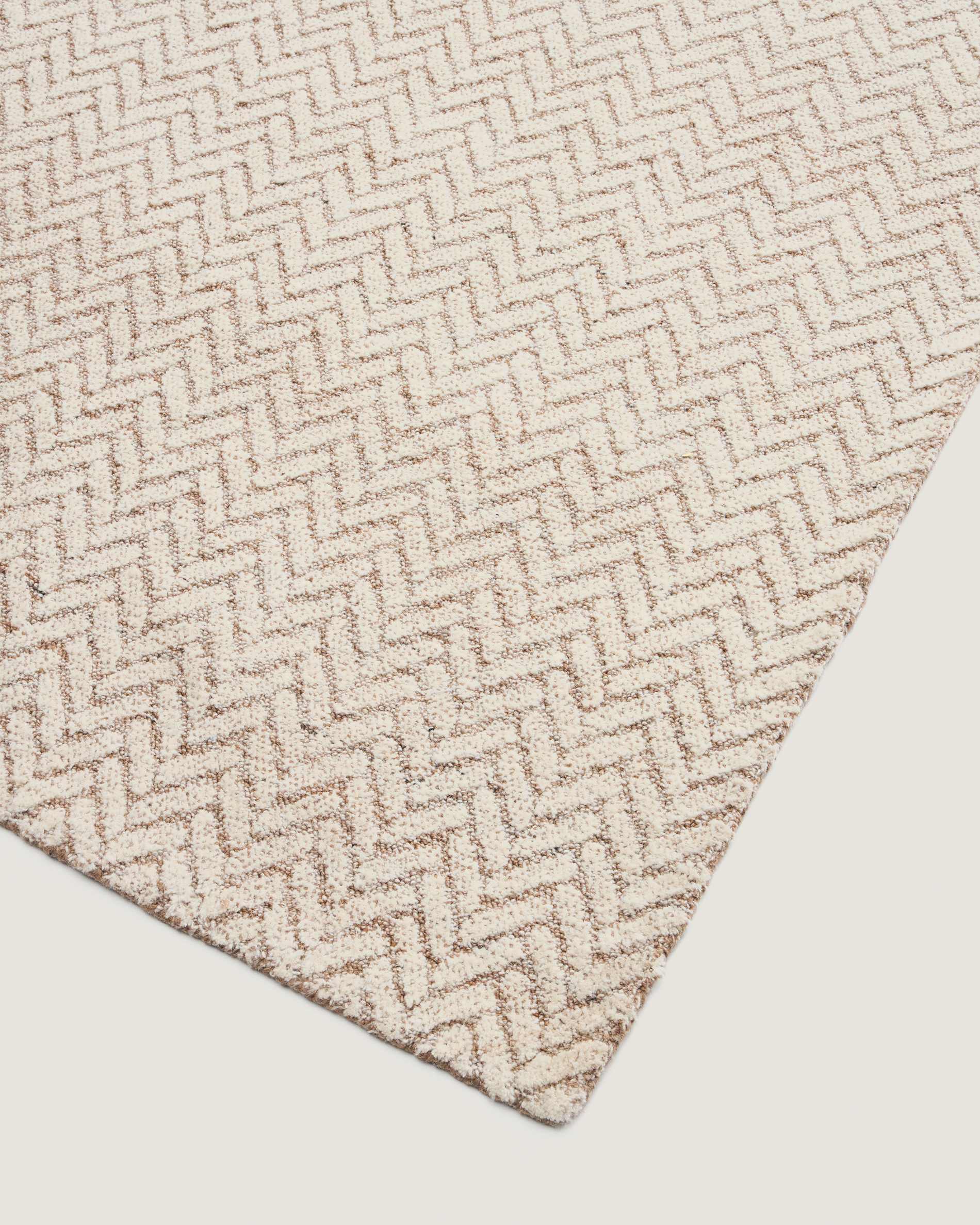 Calira beige woven jacquard wool rug 230 x 160cm