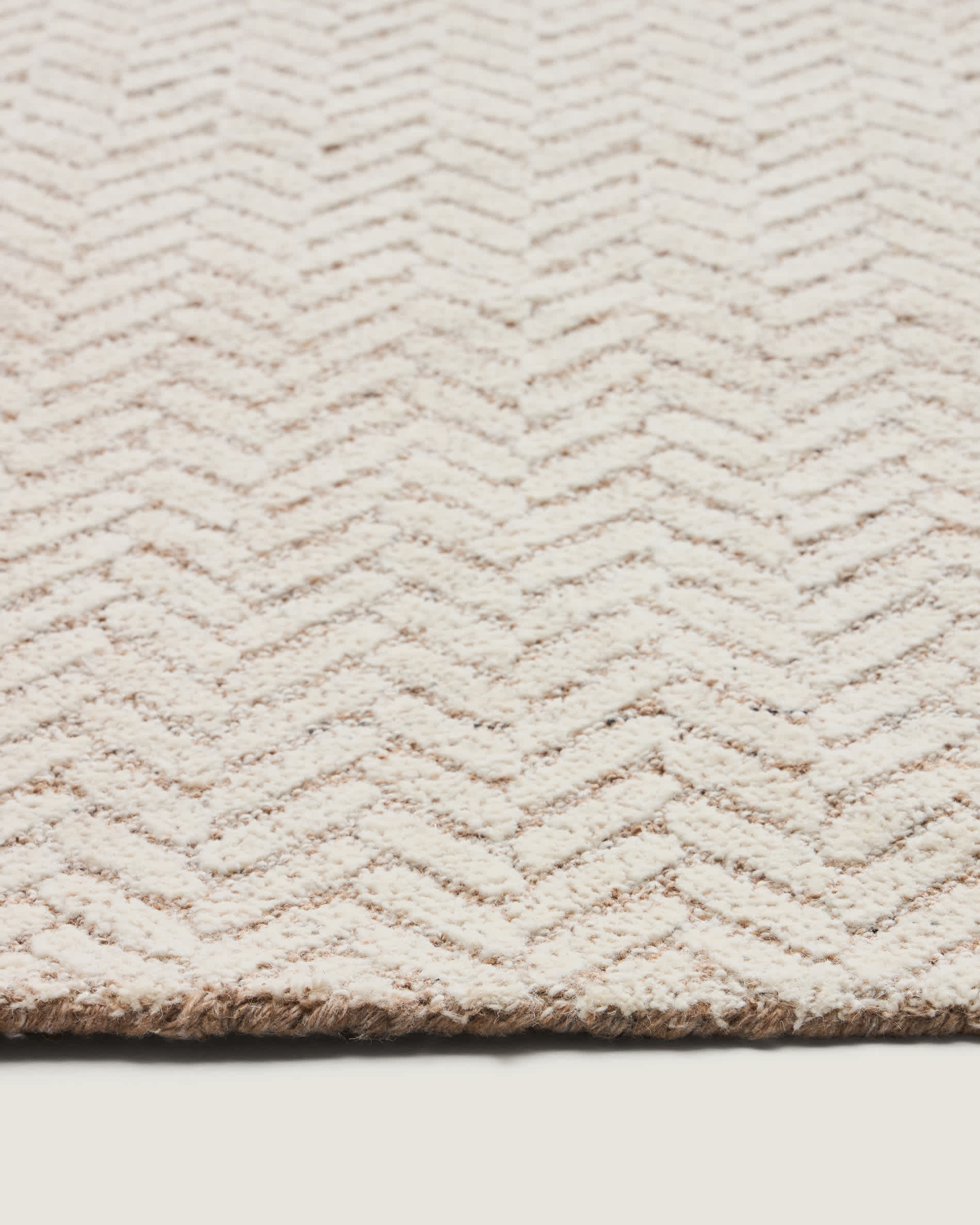 Calira beige woven jacquard wool rug 230 x 160cm