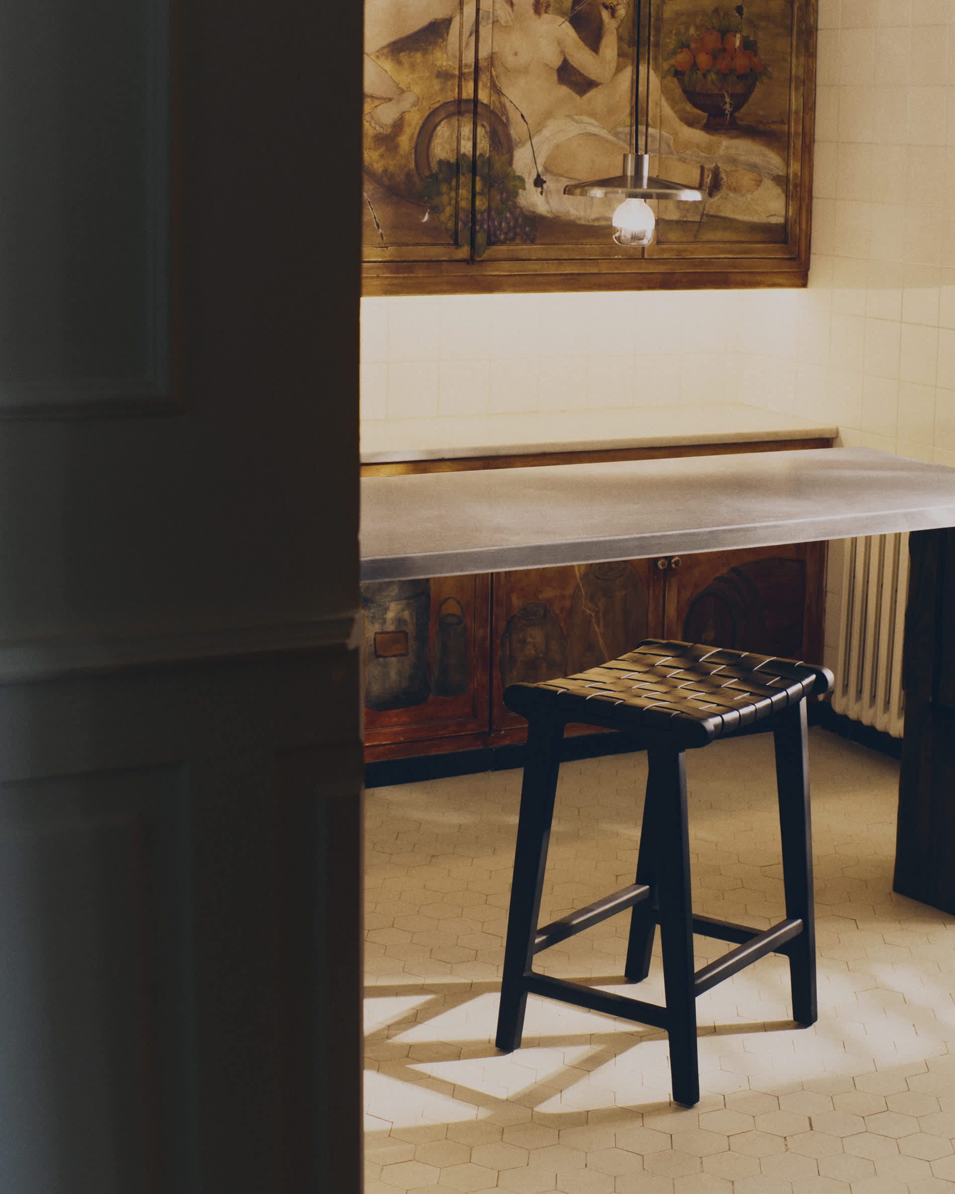 Calixta stool in leather and solid mahogany wood with black finish, 67 cm height