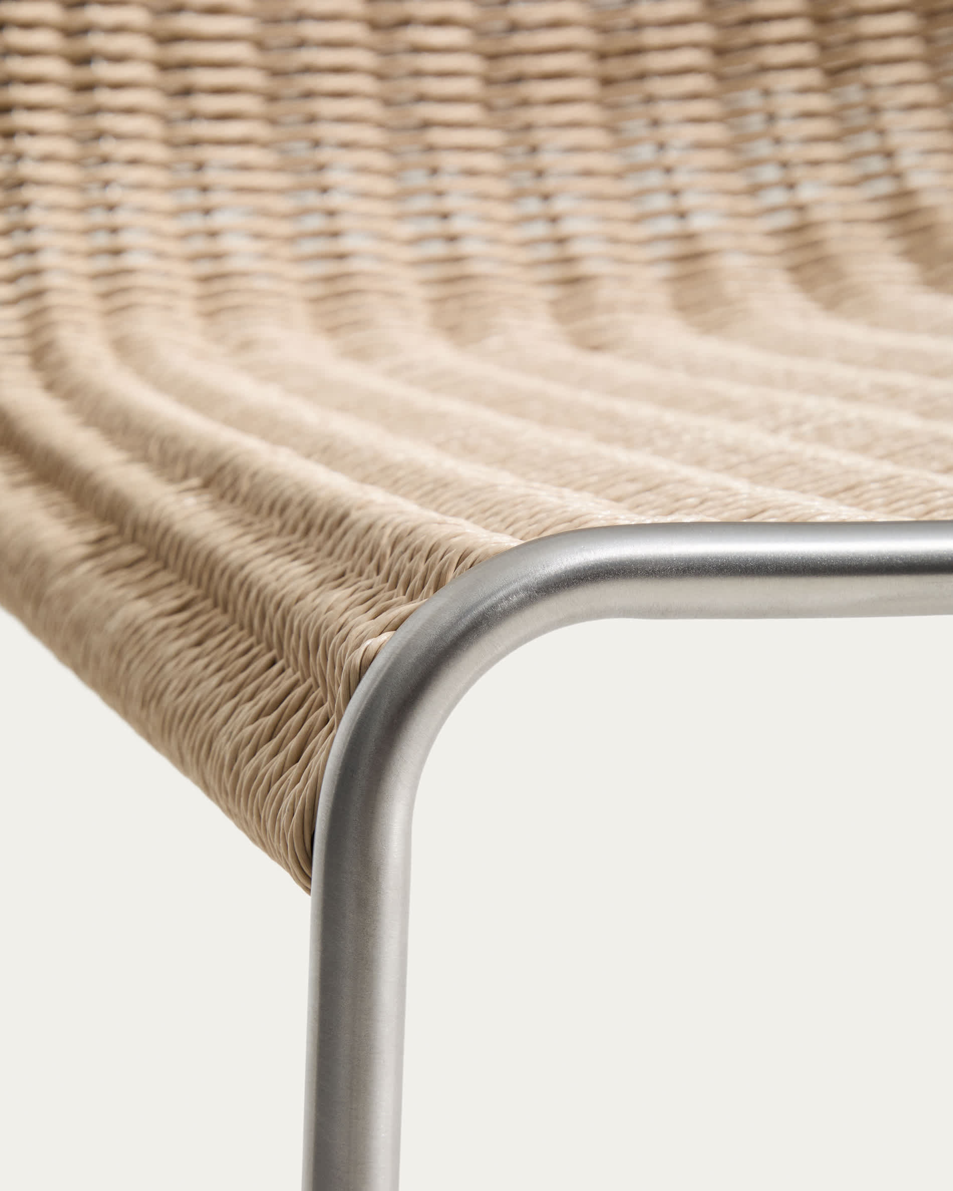 Tavari stackable chair in beige synthetic rope cord and AISI 304 stainless steel with brushed finish