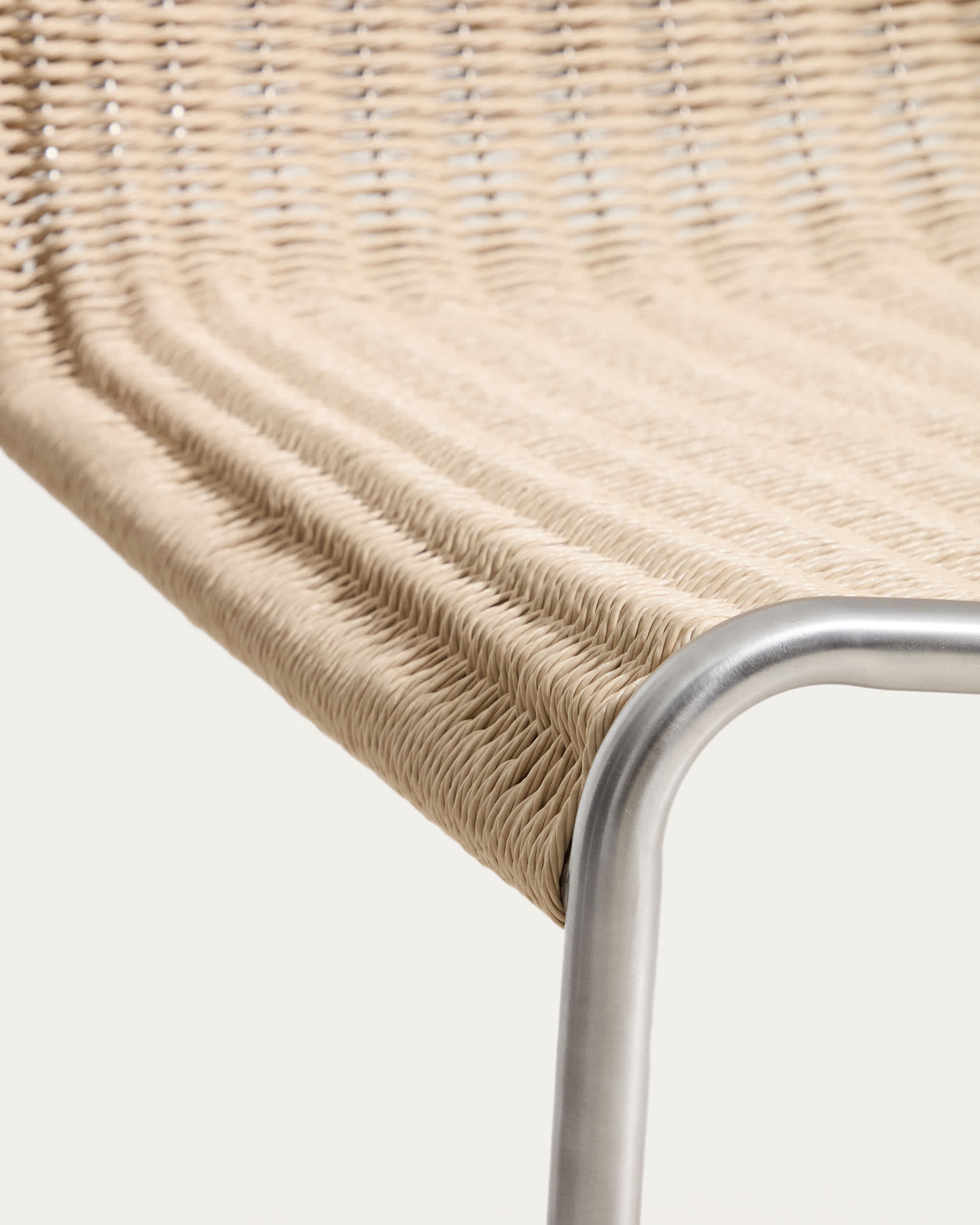 Tavari stackable armchair in beige synthetic rope cord and AISI 304 stainless steel with brushed finish