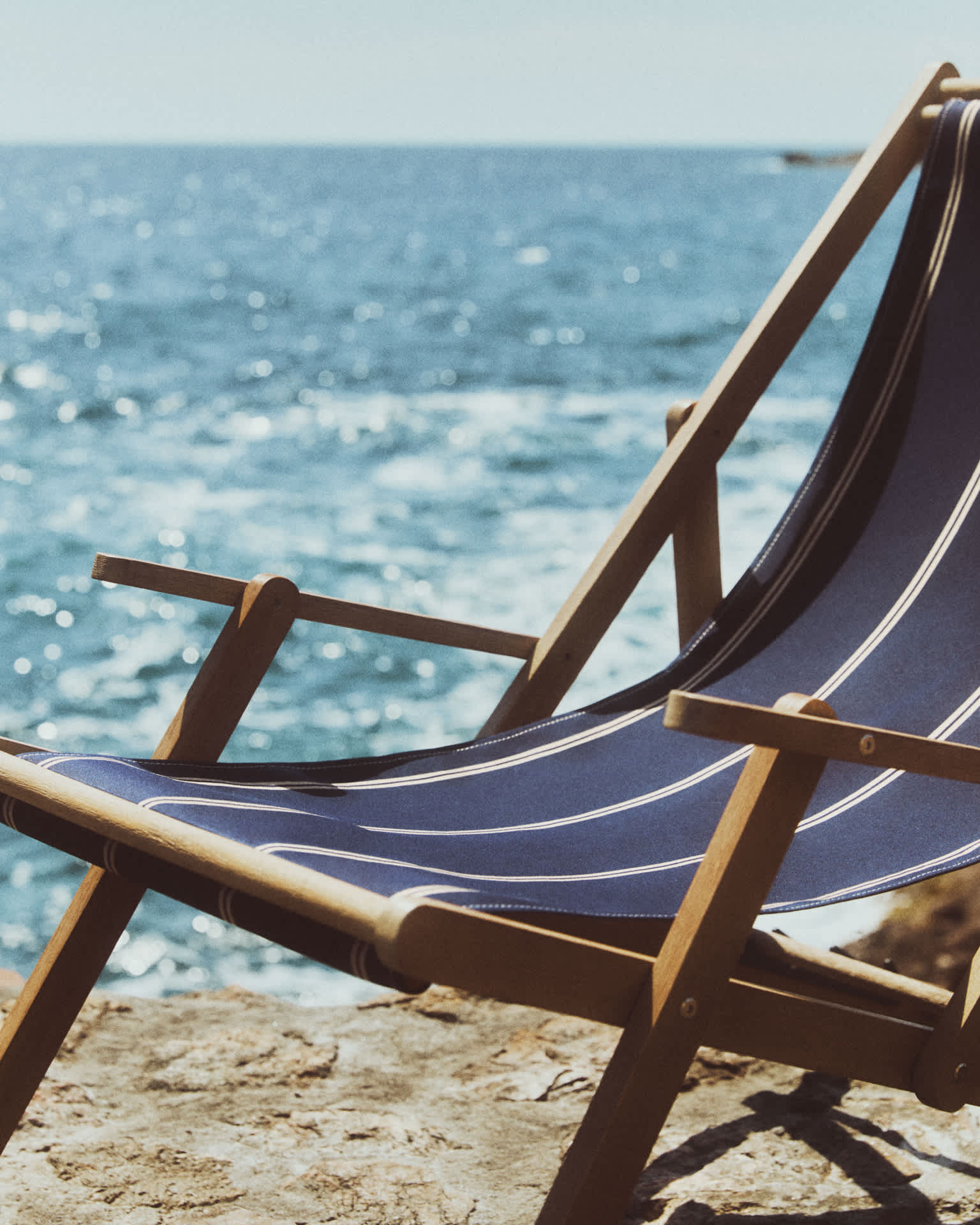 Vilara blue and beige striped outdoor folding deck chair made of FSC 100% solid acacia wood
