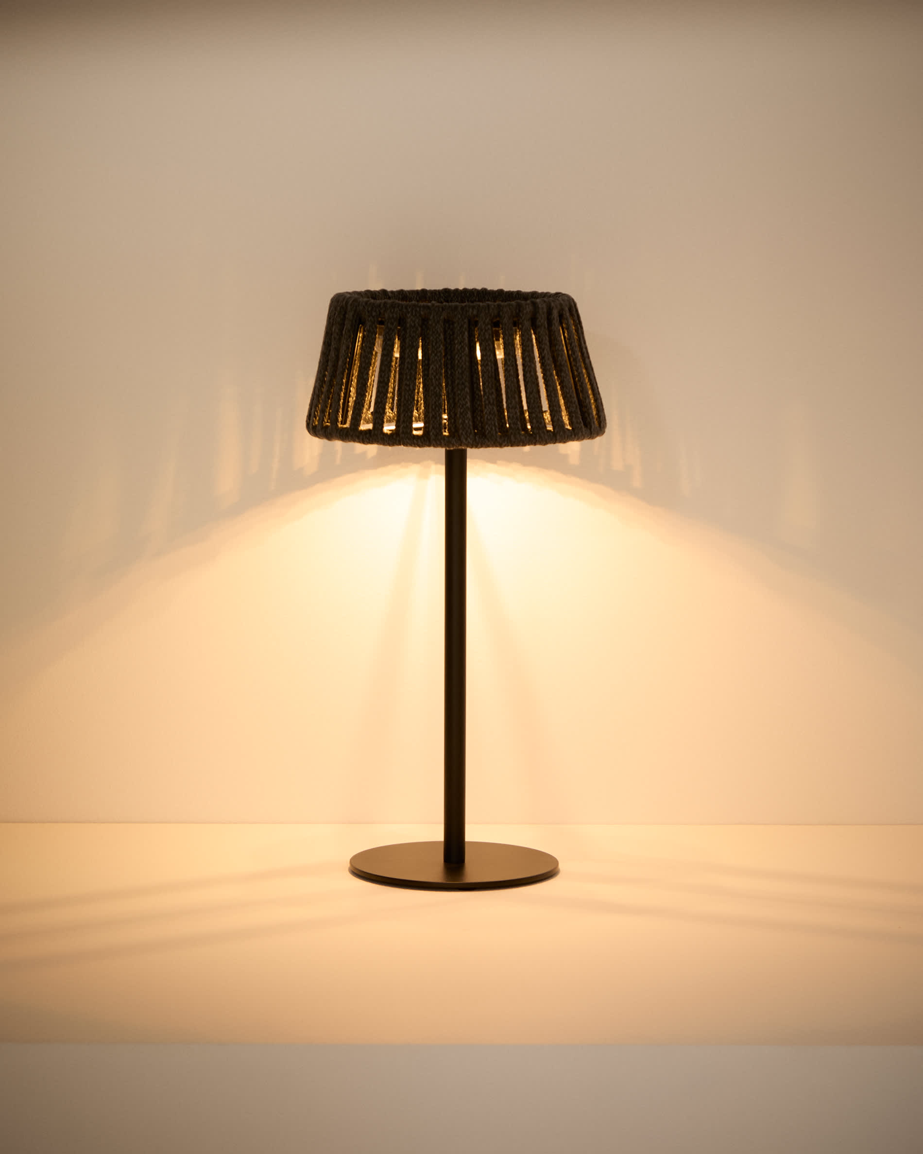 Aldet outdoor solar table lamp in black flat rope cord with metal stand