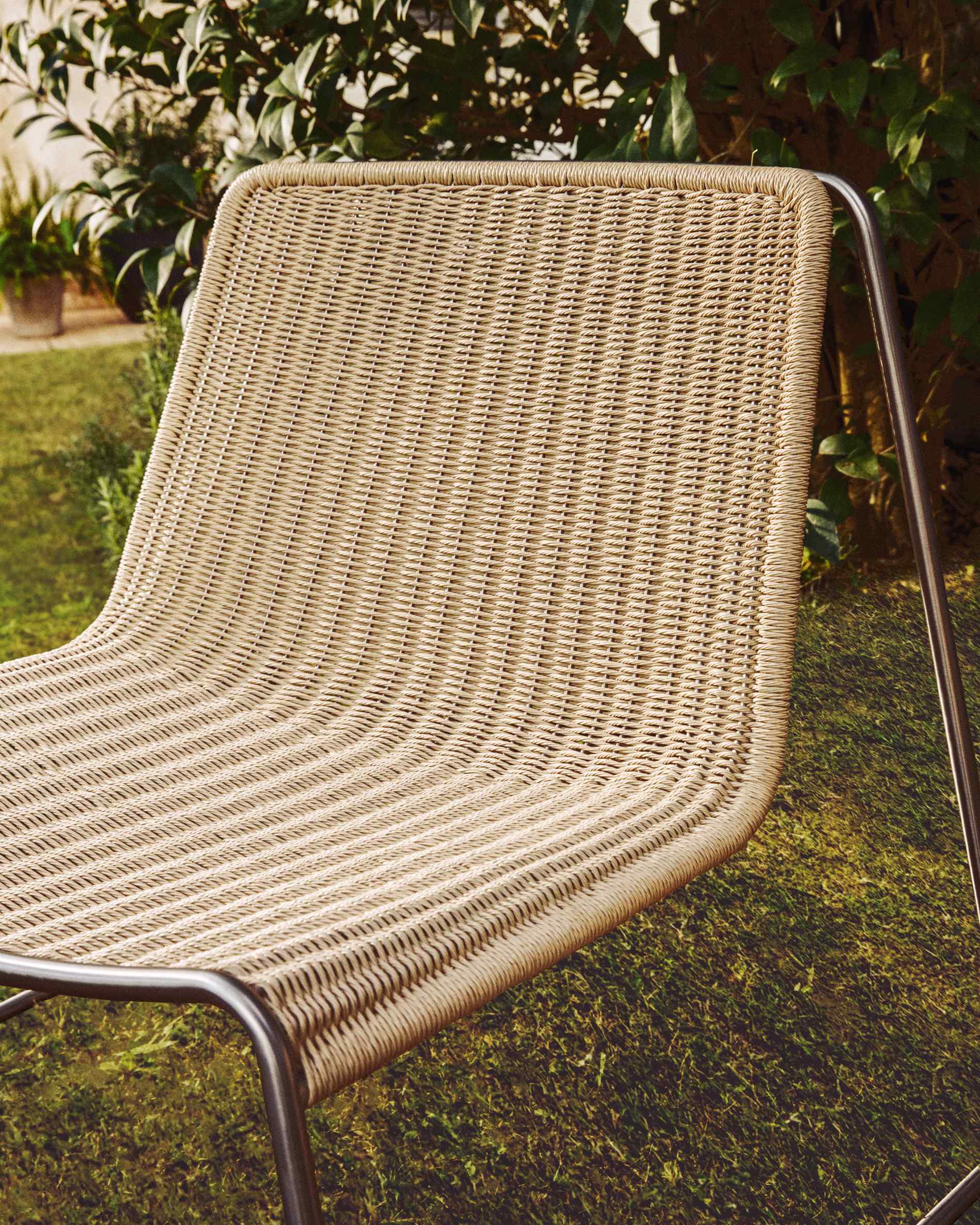 Tavari stackable armchair in beige synthetic rope cord and AISI 304 stainless steel with brushed finish