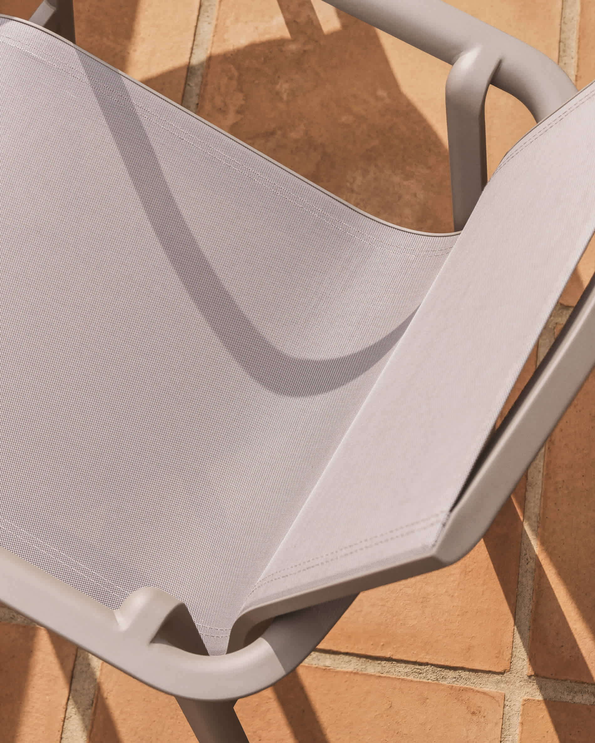 Canea stackable outdoor chair in beige texteline and taupe aluminium