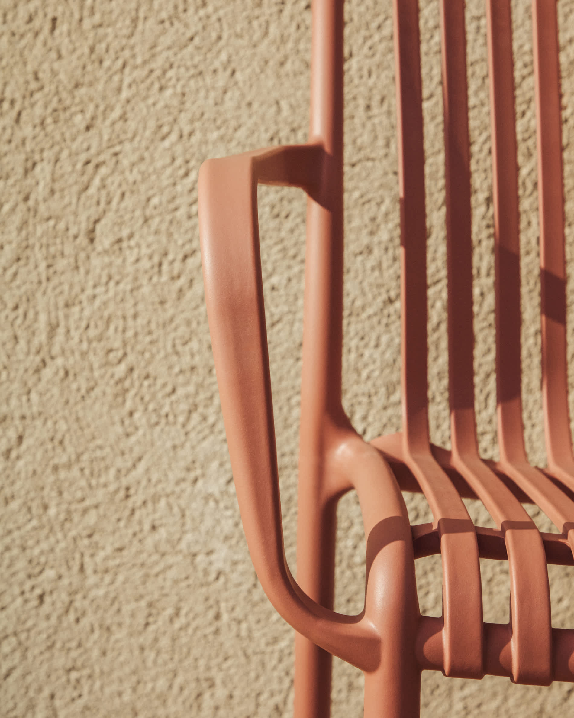 Isabellini stackable outdoor chair in terracotta
