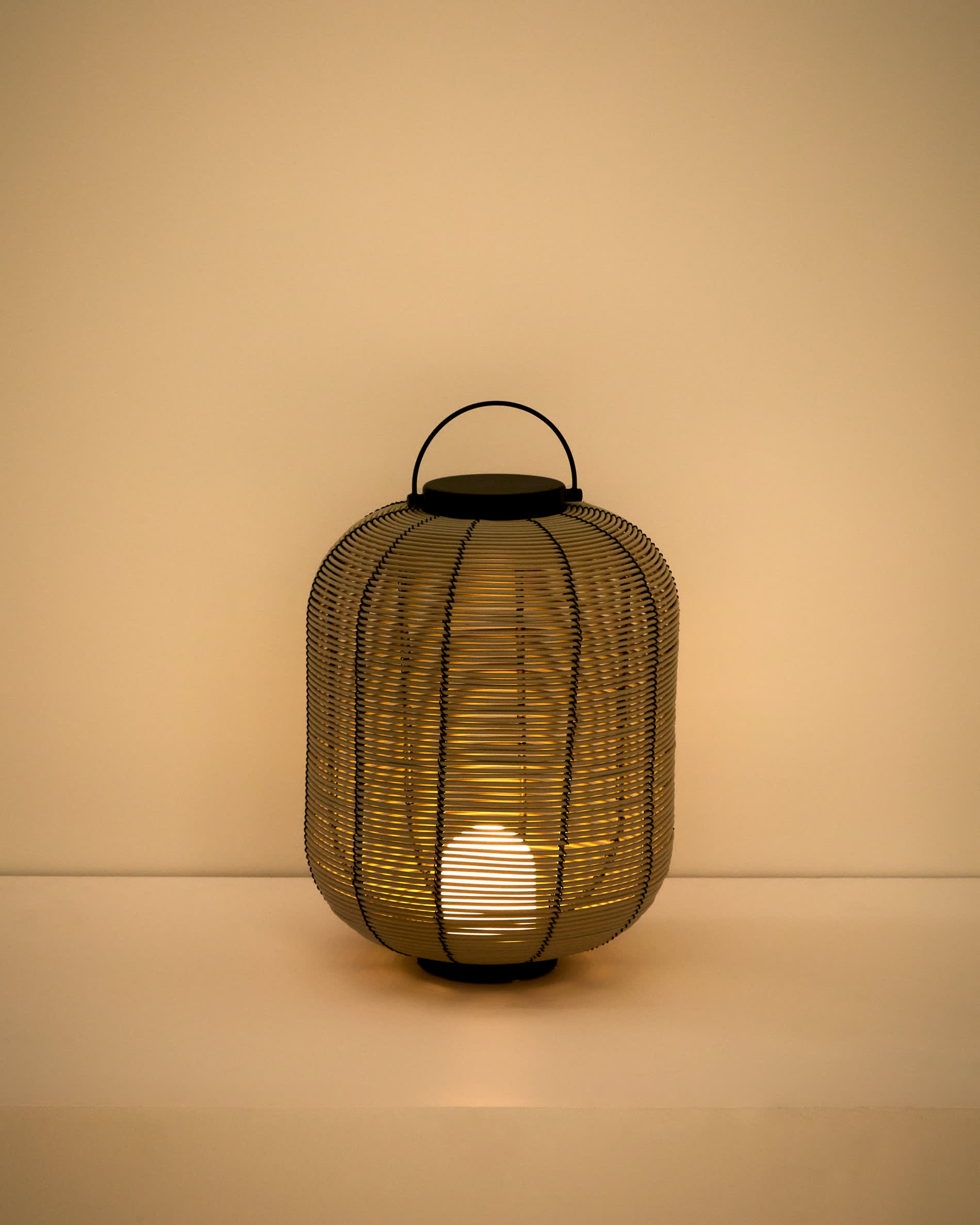 Saranella small portable LED table lamp in light grey synthetic rattan