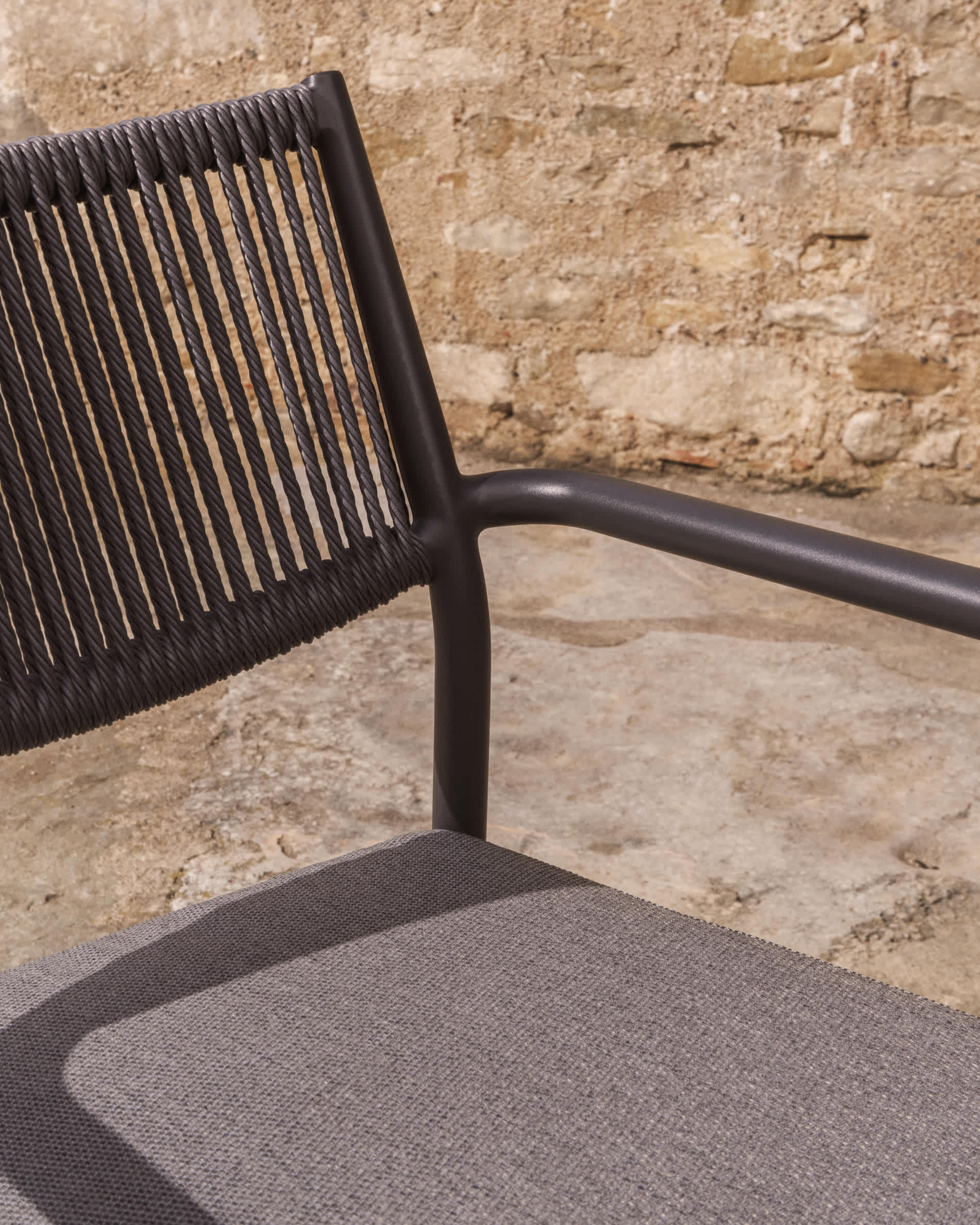 Argasi stackable outdoor chair in graphite aluminium and dark grey synthetic rope cord