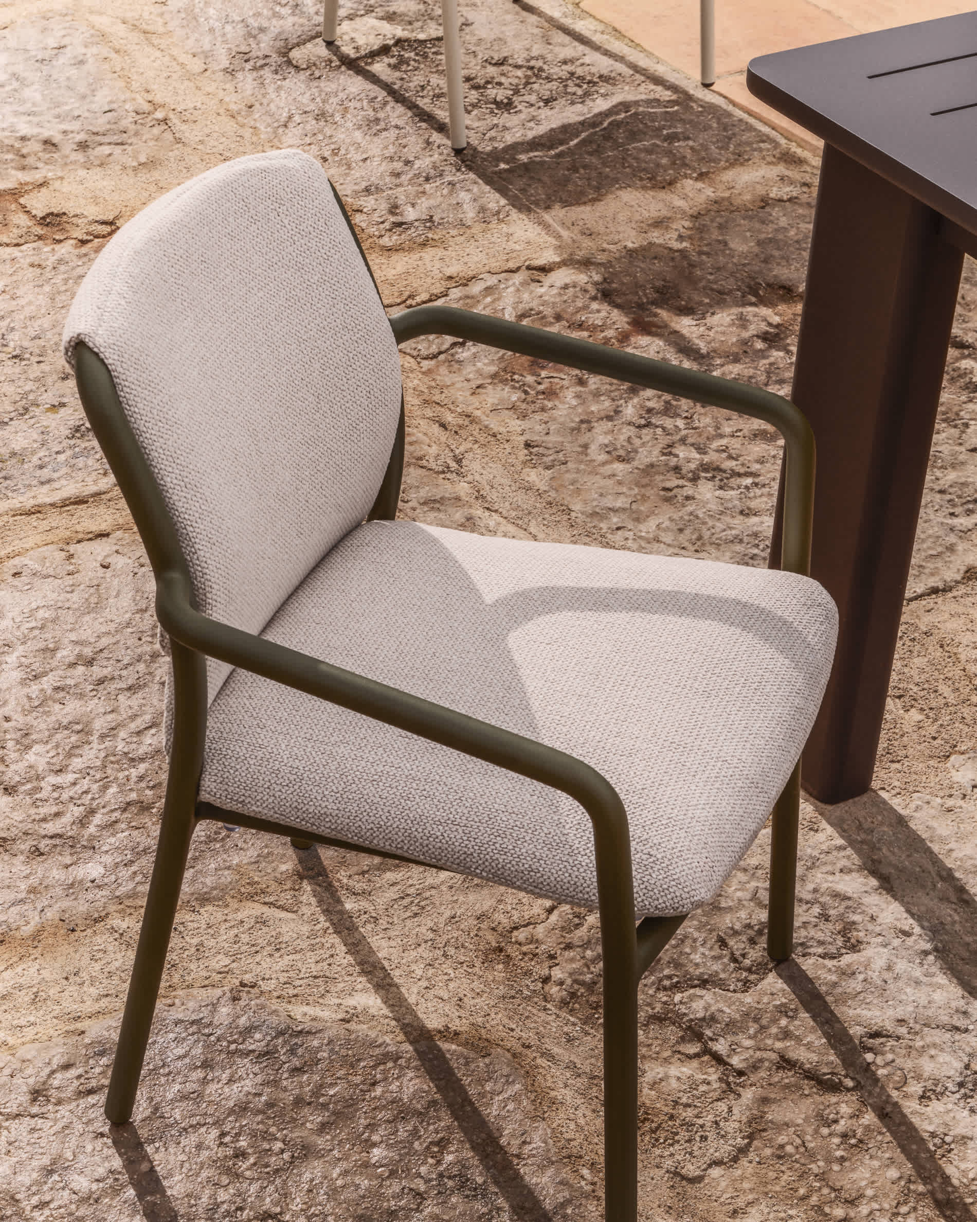 Linosa stackable outdoor chair in green aluminium with beige cushion