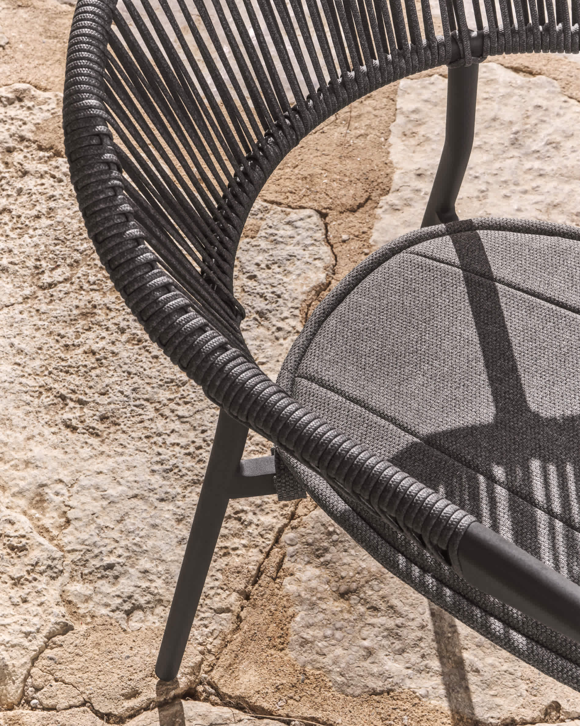 Alimia stackable outdoor chair in graphite aluminium with grey synthetic rope